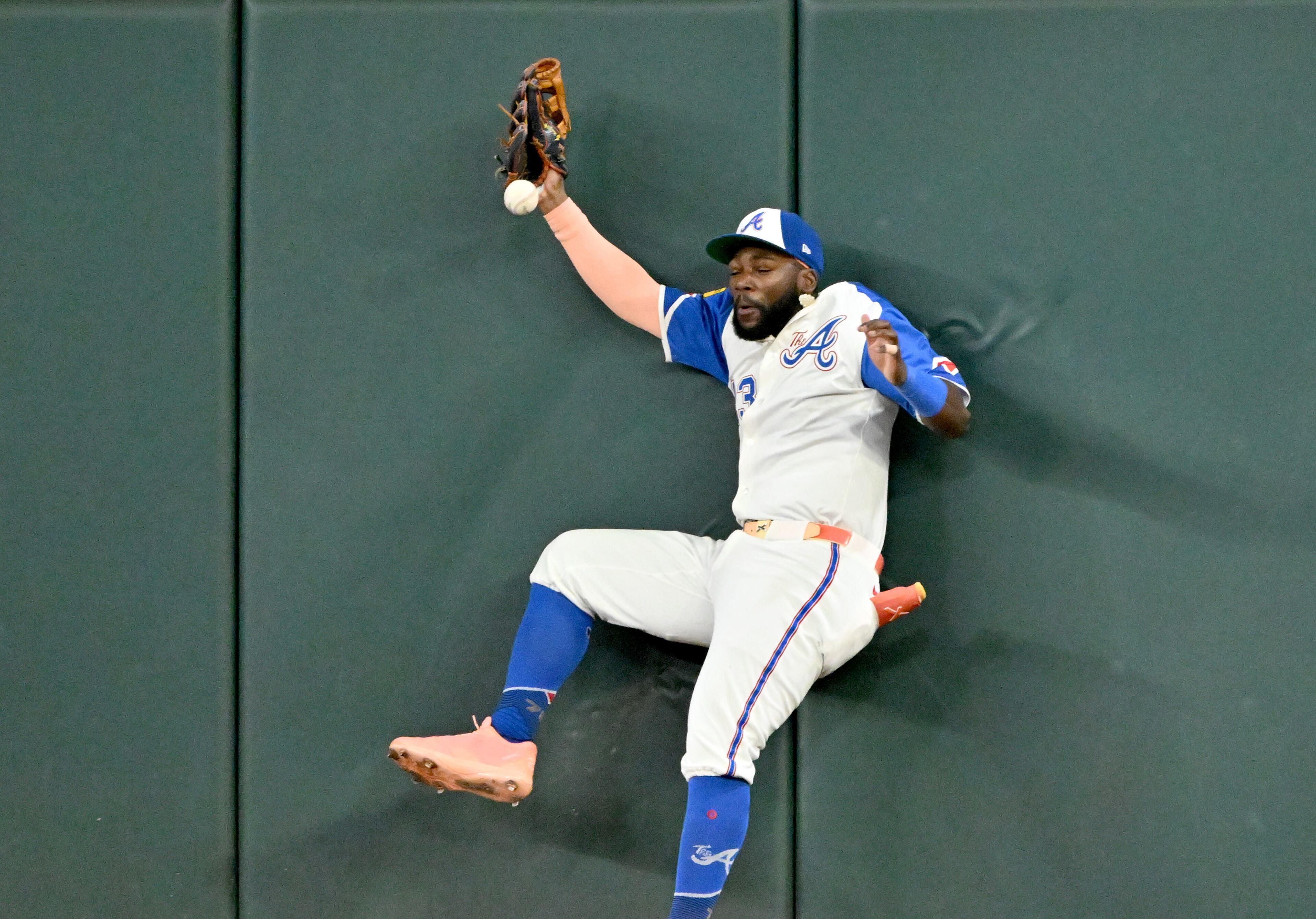 Atlanta Braves outfielder Michael Harris II (23) hits the wall as he fails to catch a double by New York Yankees first base Paul Goldschmidt (48) during the ninth inning of a baseball game at Truist Park, Saturday, July 19, 2025, in Atlanta. New York Yankees won 12-9 over Atlanta Braves. (Hyosub Shin / AJC)