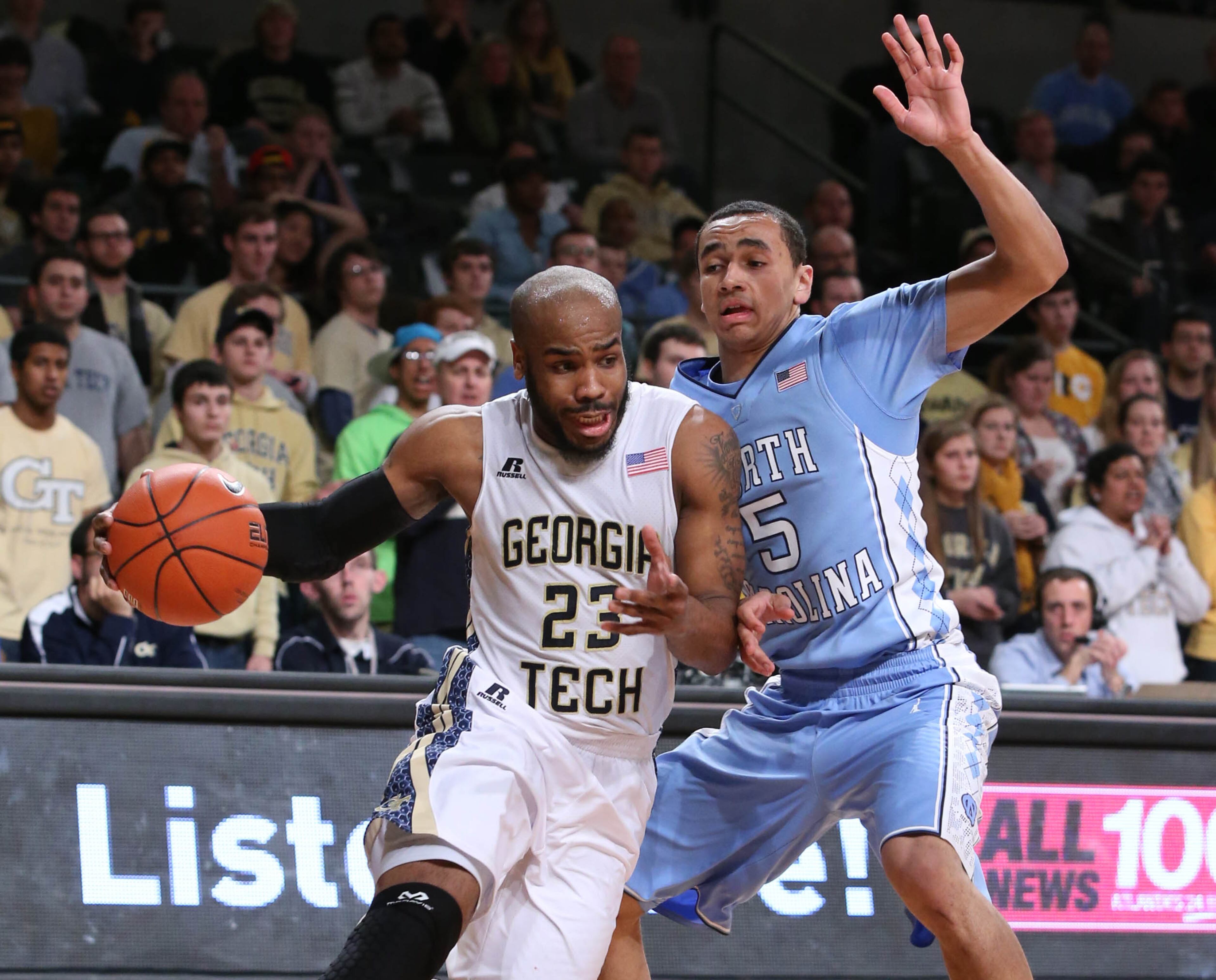 Tech guard Trae Golden (23) drives as North Carolina guard Marcus Paige (5) defends during the second half of an NCAA college basketball game