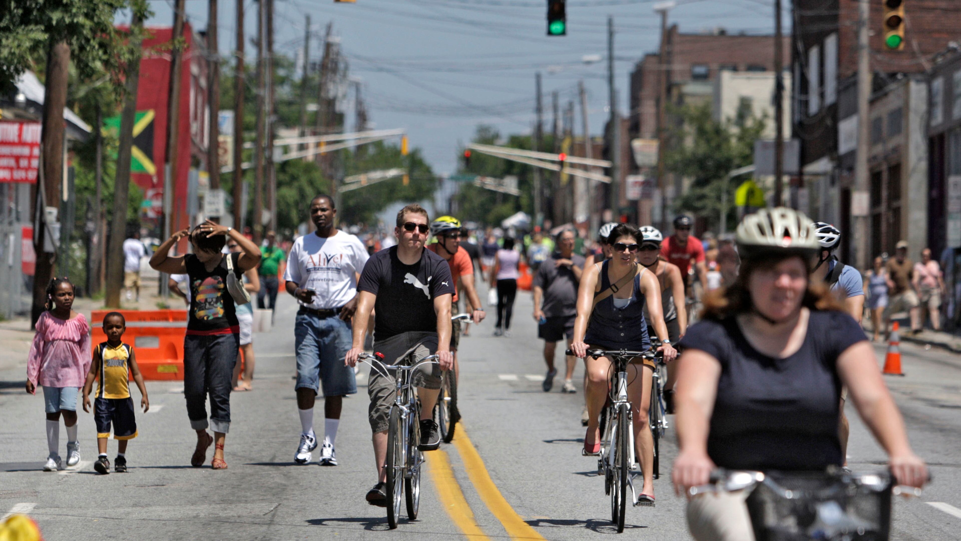 100523 - Atlanta - Edgewood Ave. is filled with pedestrians and bike riders as the street was closed for Atlanta Streets Alive. Modeled after similar events from around the world, including Colombia, San Francisco, Cleveland, and Paris, the first-ever Atlanta Streets Alive took place on Edgewood Ave. from Woodruff Park to Randolph St. Sunday. Atlanta Streets Alive was a ciclovia where the organizers closed streets to cars and opened them to all kinds of organized activities -- including belly dancing, street performing, fitness, hula hoops, tai chi, and dancing, all for free. Hundred of participants rode their bikes or walked the streets and took part in activities. Sun, May 23, 2010 Bob Andres, bandres@ajc.com