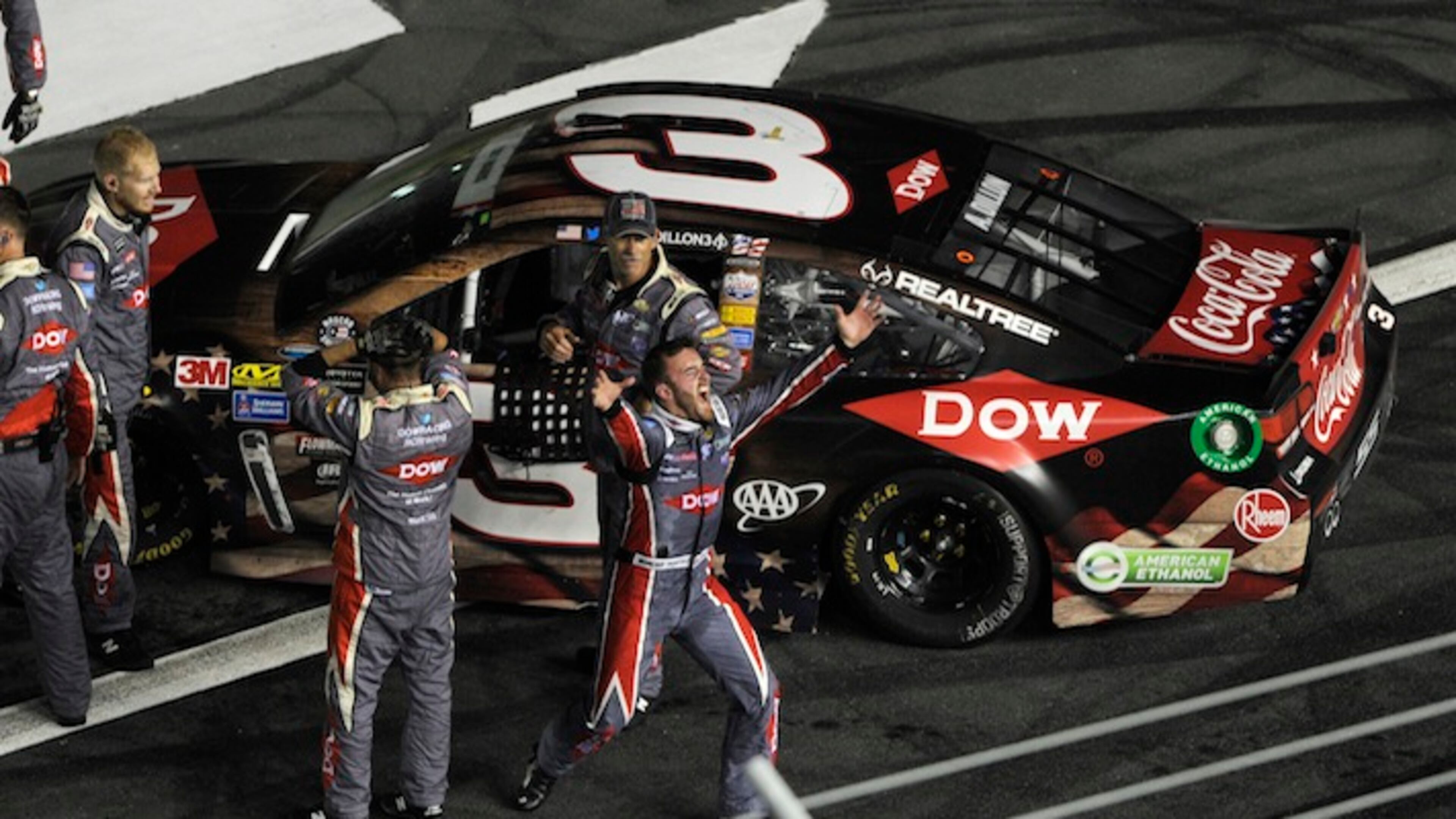 Austin Dillon, center, celebrates with his crew after winning the NASCAR Cup series auto race at Charlotte Motor Speedway in Concord, N.C., Monday, May 29, 2017. (AP Photo/Mike McCarn)