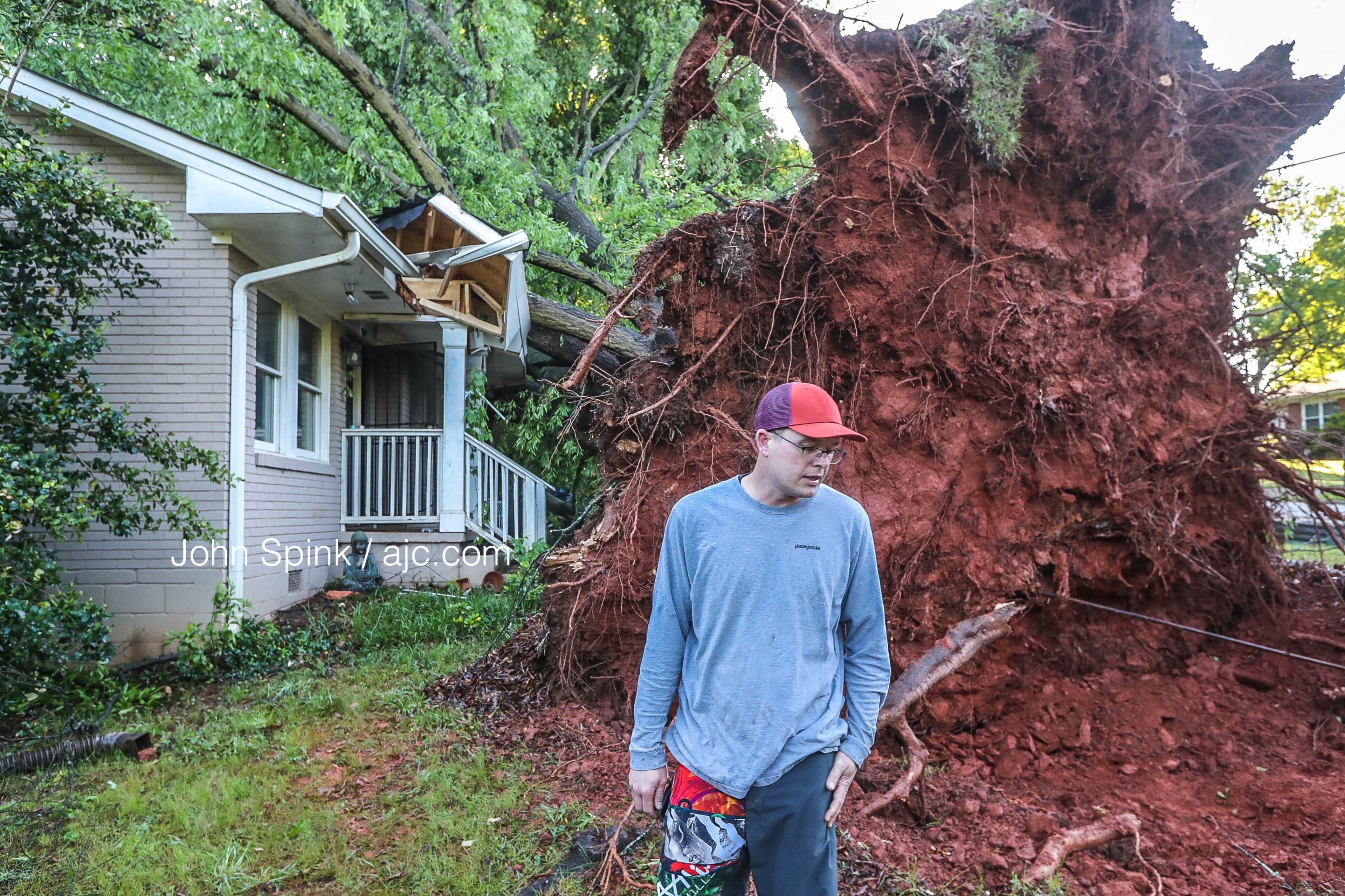 Daniel Hedges said he heard a loud cracking sound coming from his son's room Wednesday night. He later learned a massive tree caused the room's ceiling to cave in.
