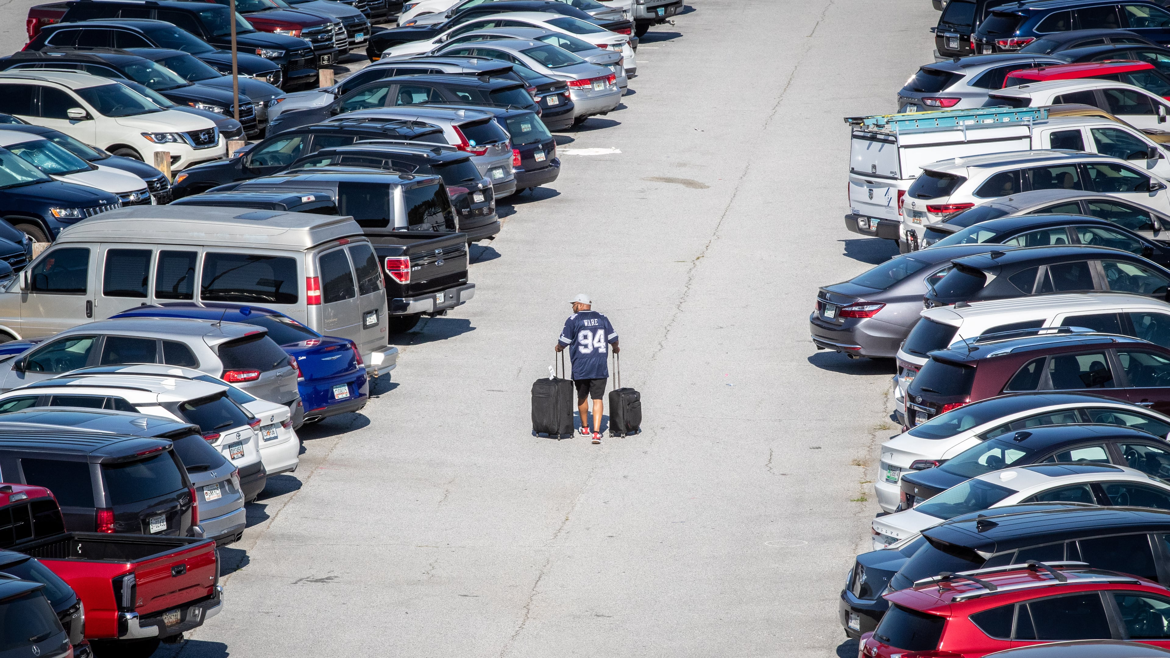 A passenger heads to his car in the nearly full South Economy Parking lot at Hartsfield Jackson International Airport Wednesday, June 22, 2022. Steve Schaefer / steve.schaefer@ajc.com)