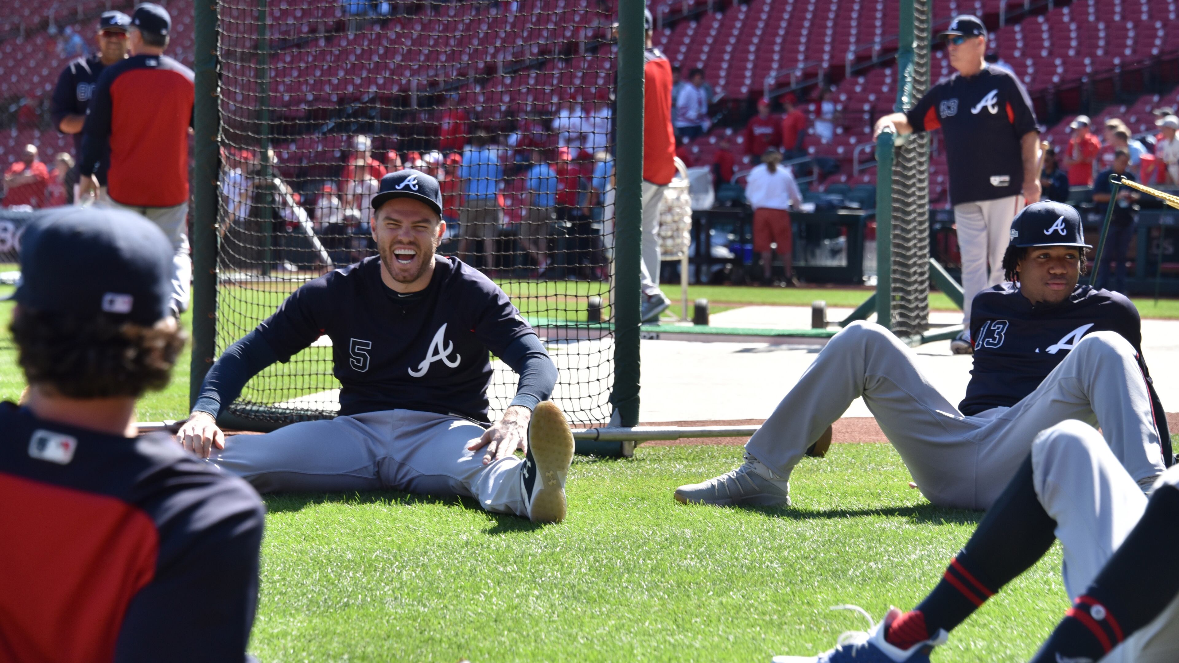 Atlanta Braves first baseman Freddie Freeman (5) and center fielder Ronald Acuna (13) warm up before the start of Game 4 of the Division Series against the Cardinals Monday, Oct. 7, 2019, at Busch Stadium in St. Louis.