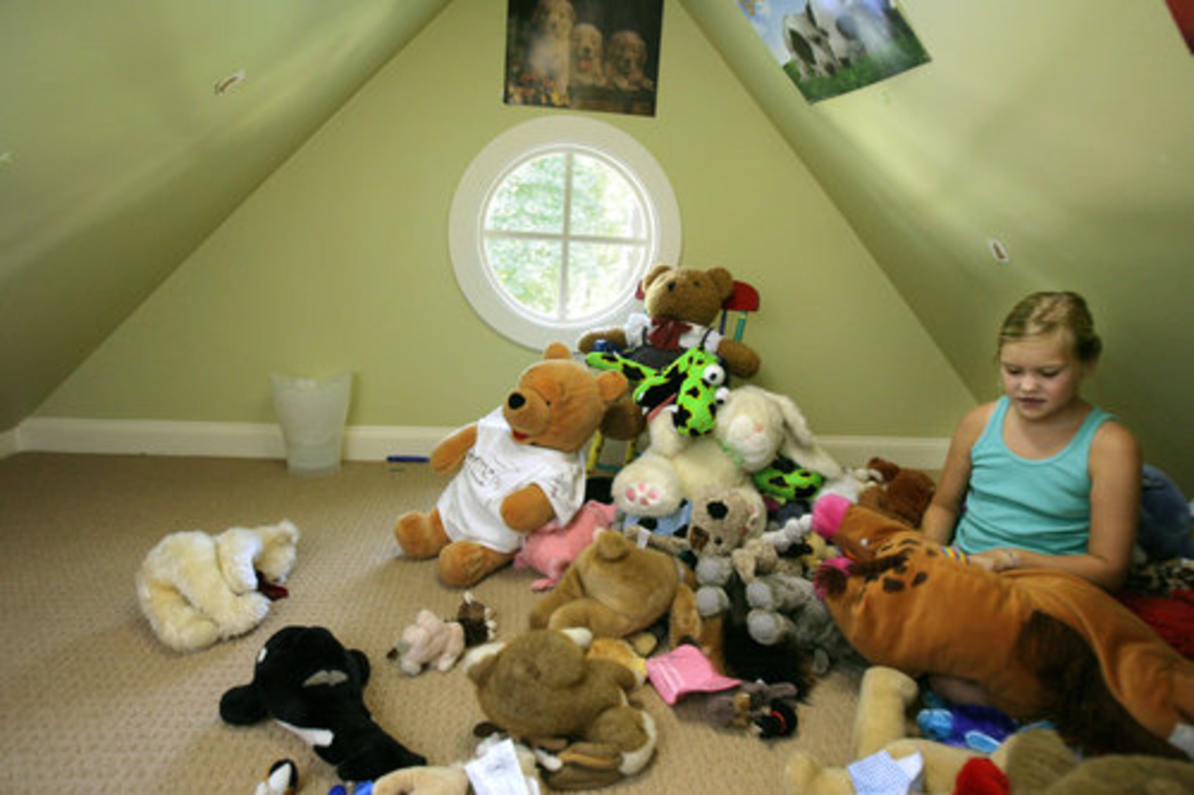 The playroom has a hideaway under the eaves that the girls call their fort.