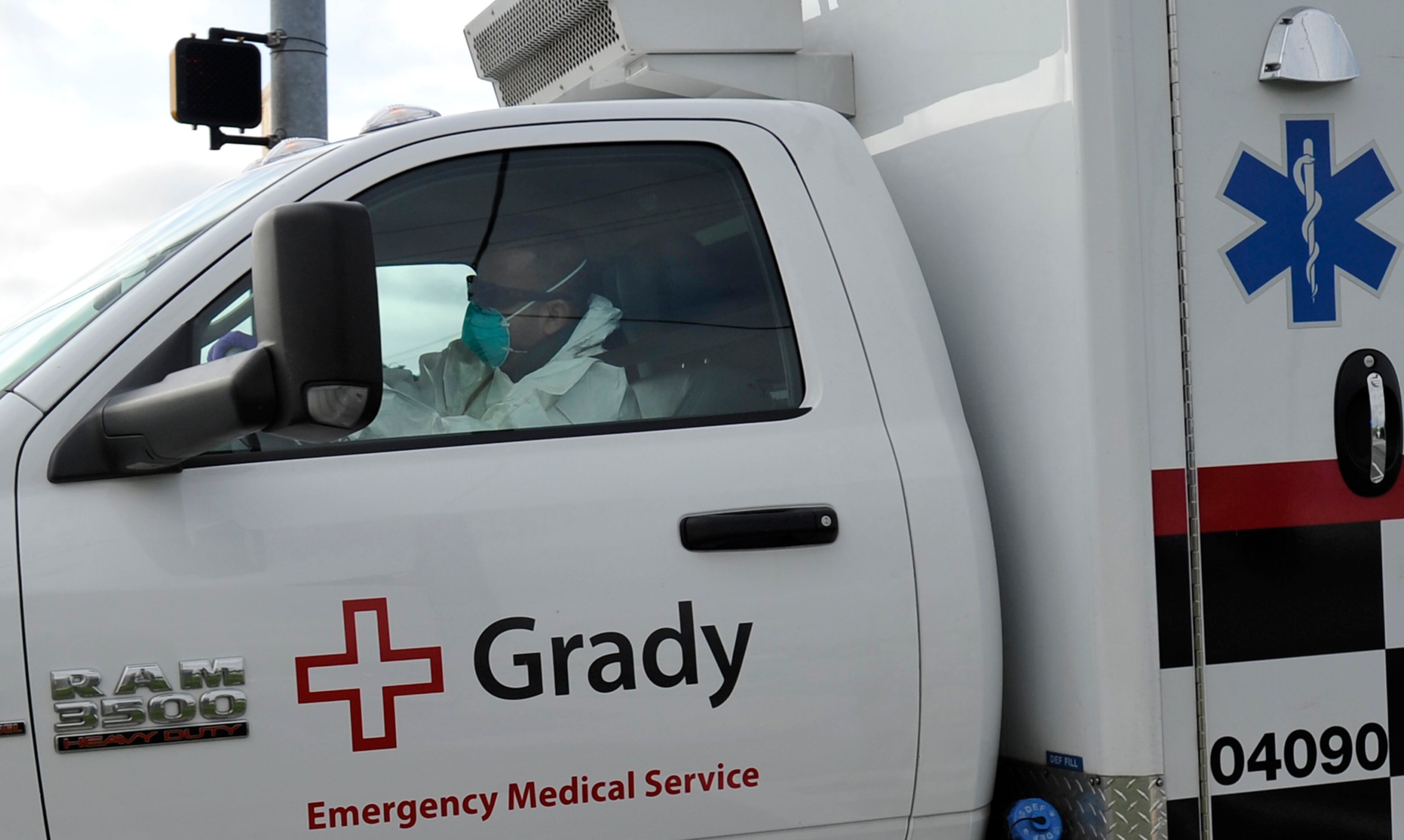 An ambulance transporting an American infected with the deadly Ebola virus from West Africa, leaves Dobbins Air Reserve Base Tuesday, Sept. 9, 2014 in Marietta, Ga., for Emory University Hospital in Atlanta. A joint emergency isolation unit administered by Emory University Hospital and the Centers for Disease Control and Prevention successfully treated two Americans last month in Atlanta. (AP Photo/David Tulis)
