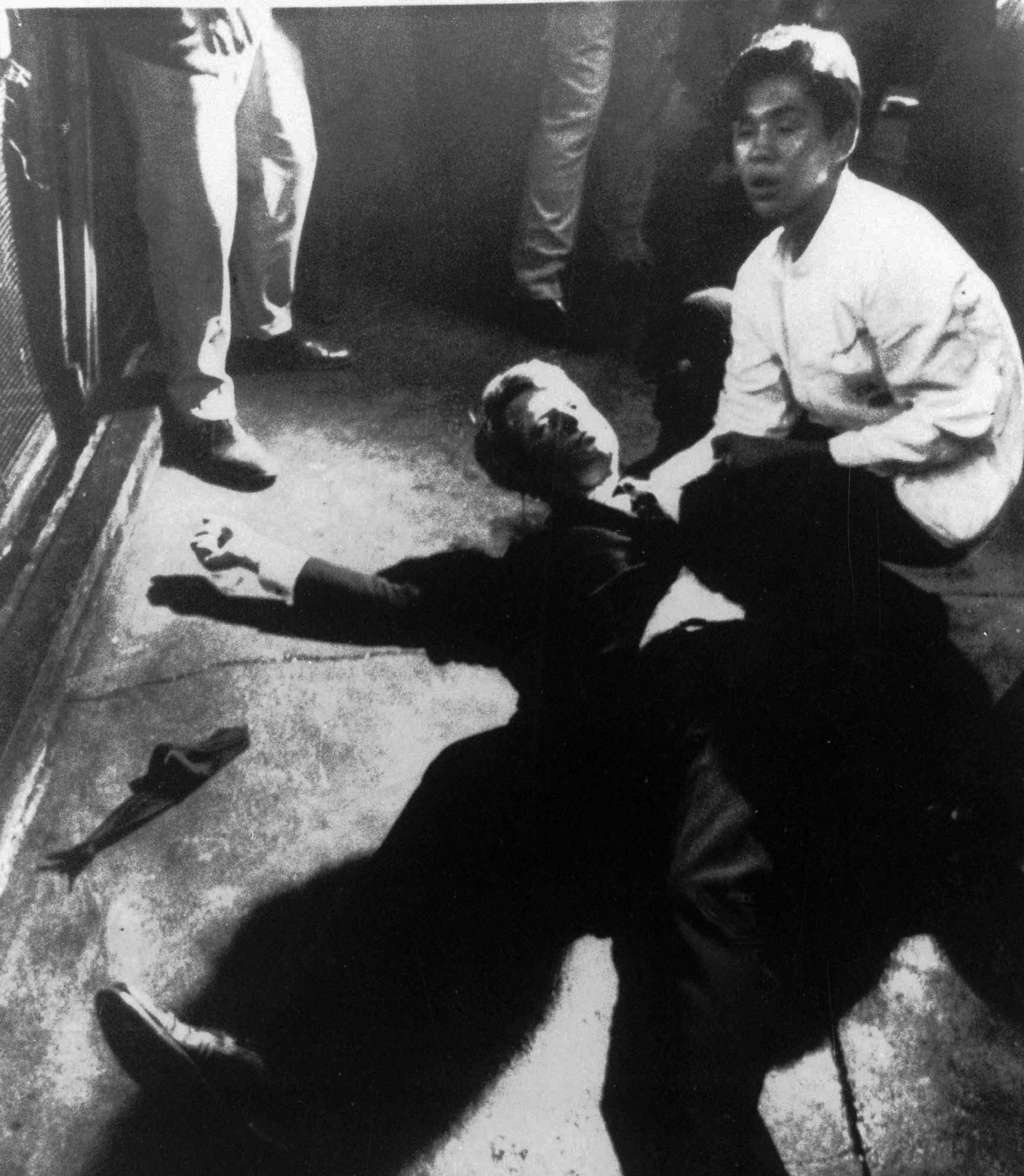 Senator Robert F. Kennedy lies on the floor of the Ambassador Hotel in Los Angeles moments after he was shot June 5, 1968. (Boris Yaro / Los Angeles Times)
