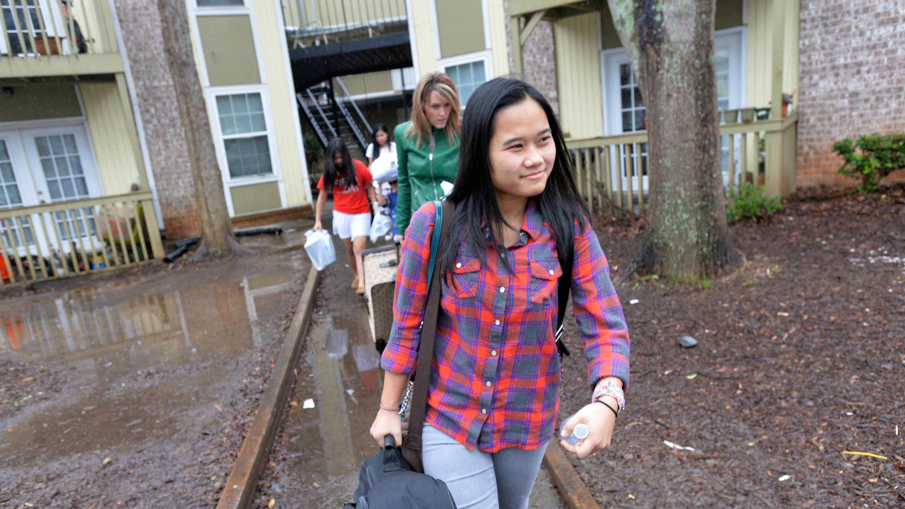 Paw Ner Moo leaves her apartment home for her missionary trip. HYOSUB SHIN / HSHIN@AJC.COM