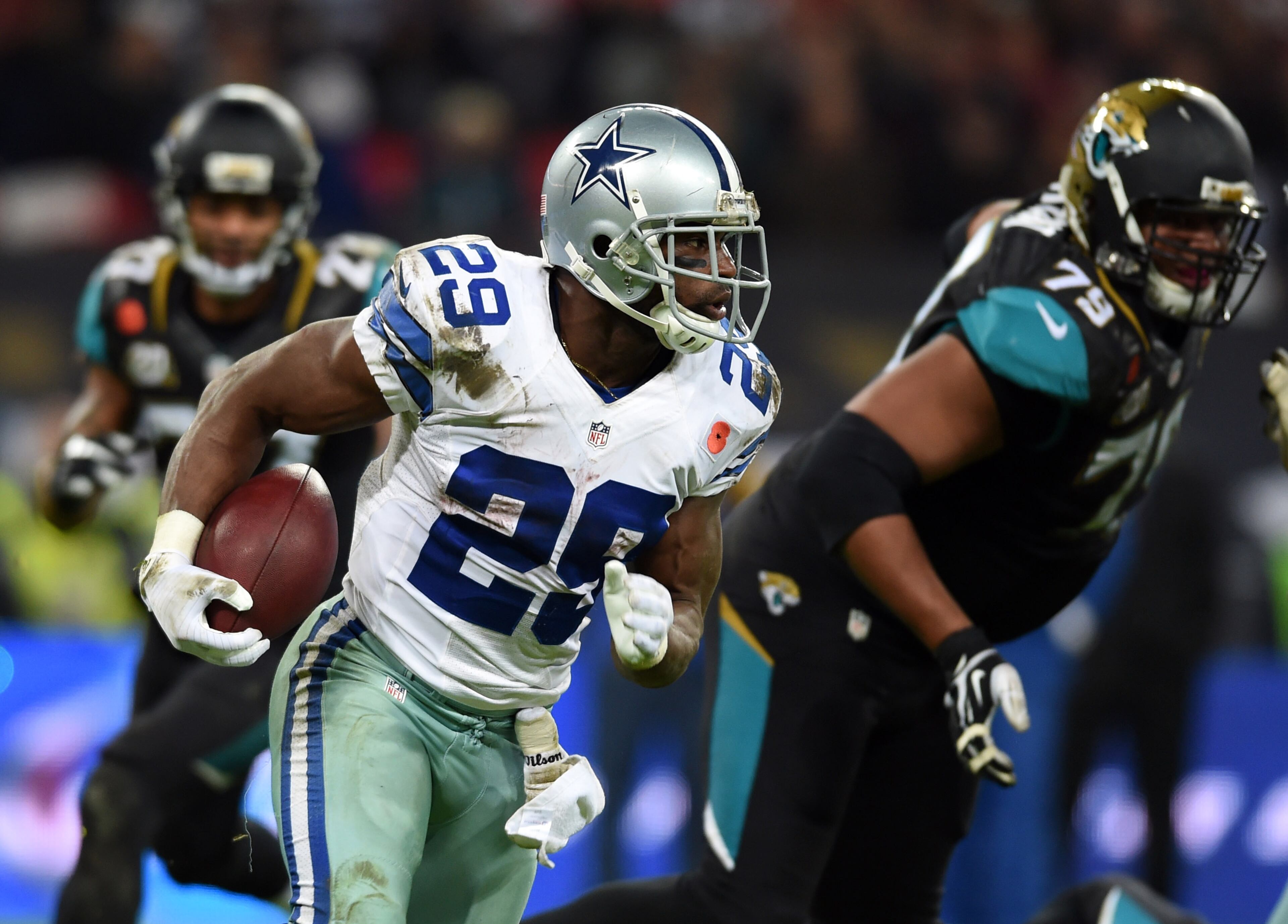 Dallas Cowboys running back DeMarco Murray (29) runs the ball against the Jacksonville Jaguars during the second half of an NFL football game at Wembley Stadium, London, Sunday, Nov. 9, 2014. (AP Photo/Tim Ireland)