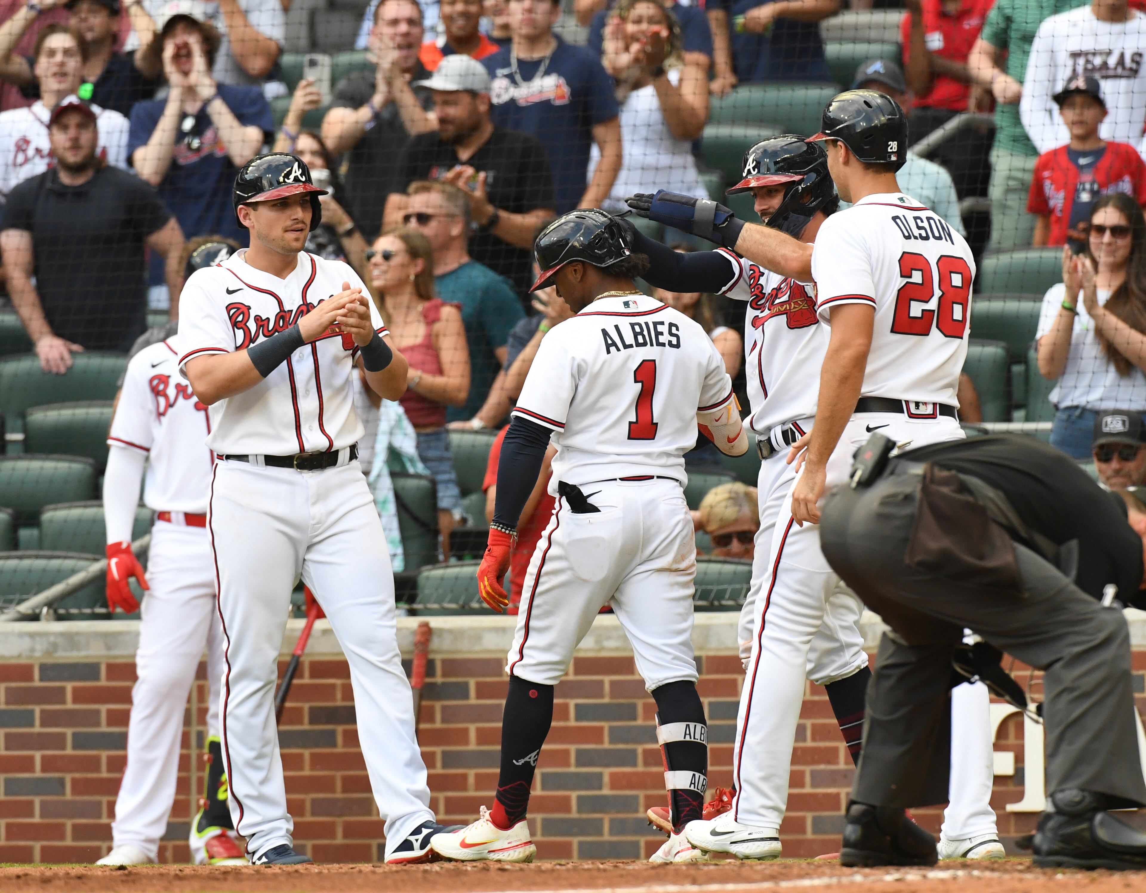 June 11, 2022 Atlanta - Atlanta Braves' third baseman Ozzie Albies (1) celebrates with teammates after hitting a grand slam in the 7th inning at Truist Park on Saturday, June 11, 2022. Atlanta Braves won 10-4 over Pittsburgh Pirates. (Hyosub Shin / Hyosub.Shin@ajc.com)