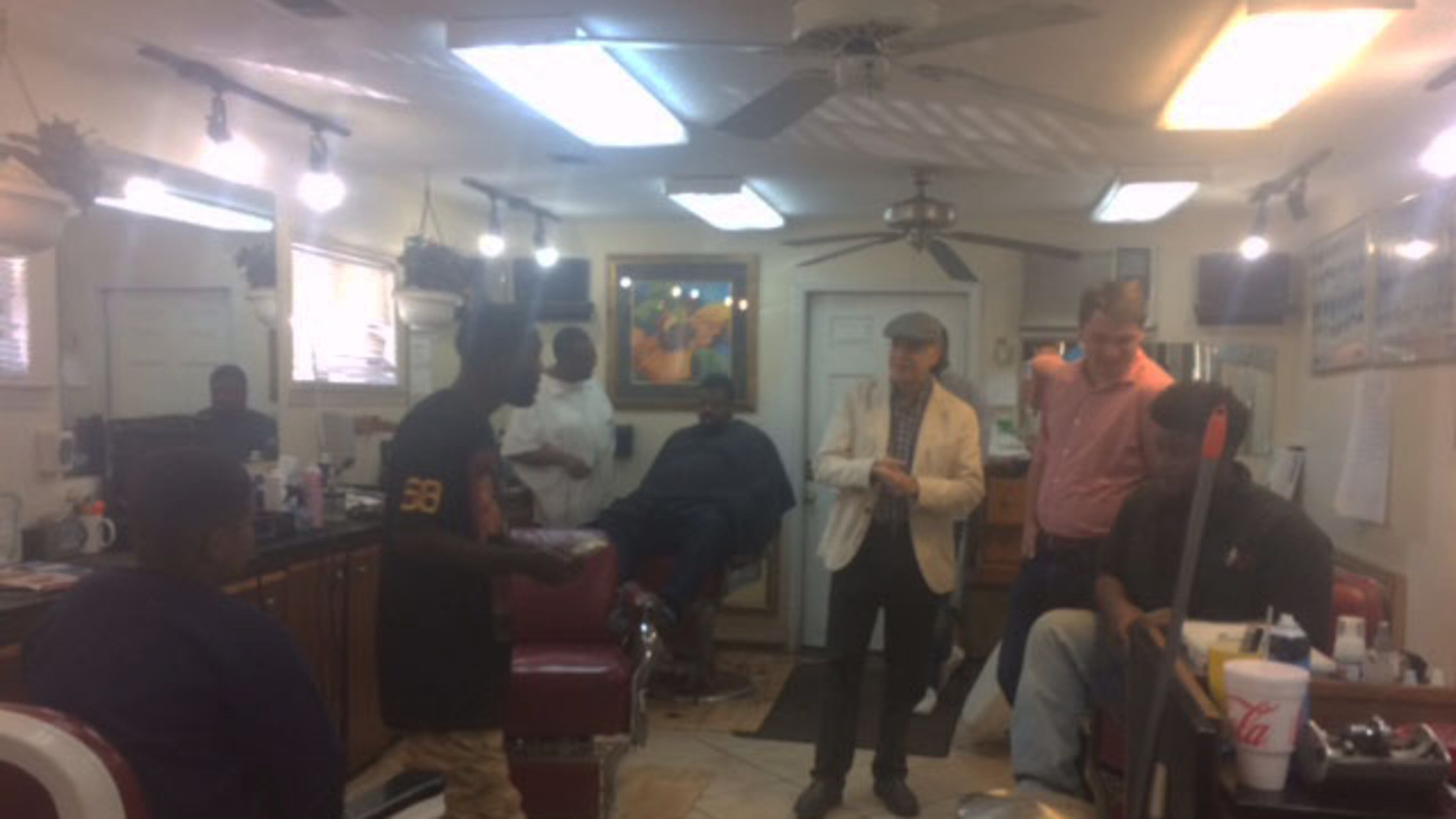 U.S. Senate candidate Jim Barksdale meets with patrons at Holmes Barber Shop in Savannah on Nov. 5, 2016. Tamar Hallerman/AJC.