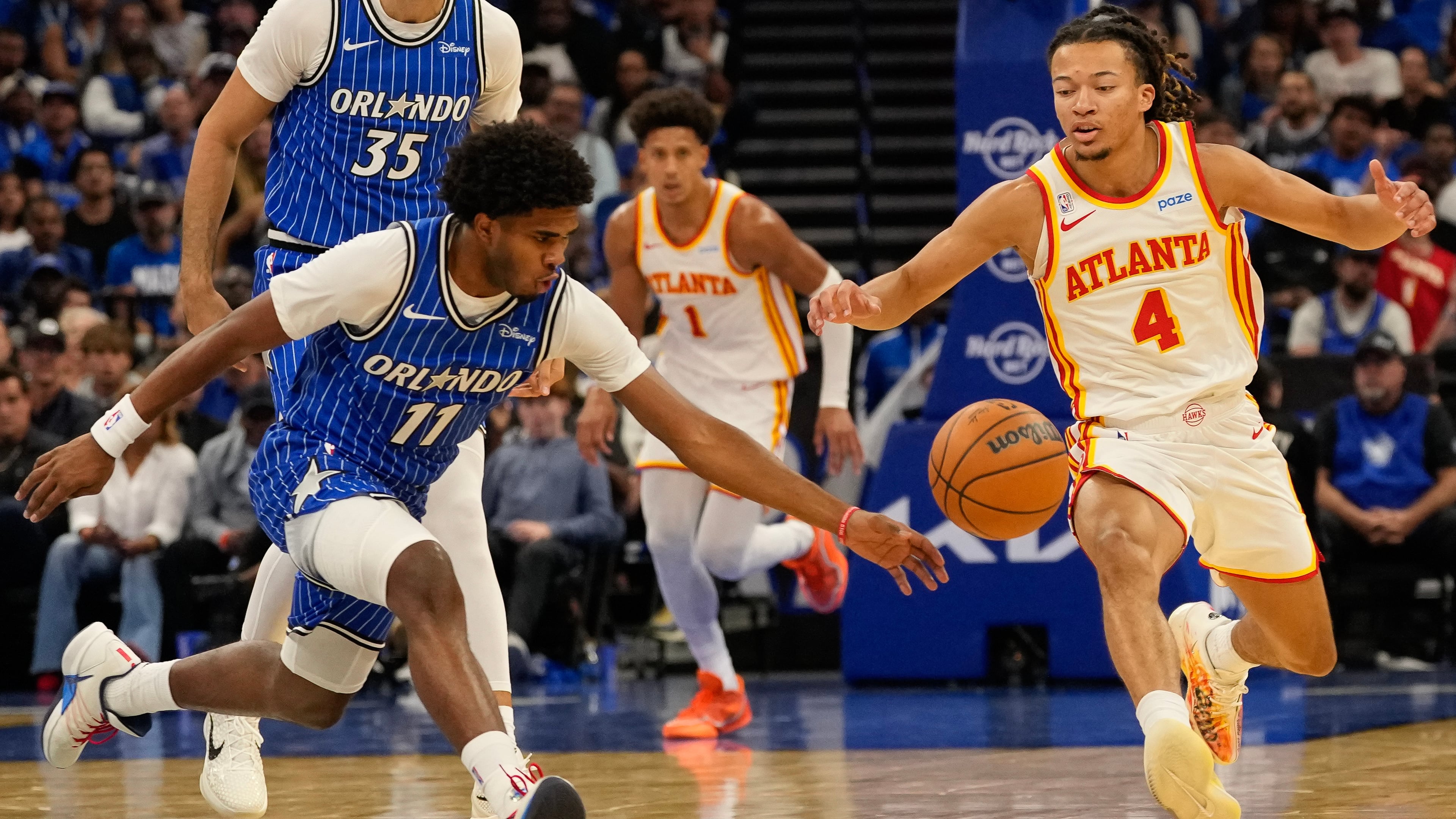 Orlando Magic guard Jase Richardson and Atlanta Hawks guard Kingston Flemings (right) go after a loose ball during the first half of an NBA basketball game, Wednesday, Oct. 21, 2026, in Orlando, Fla. (John Raoux/AP)