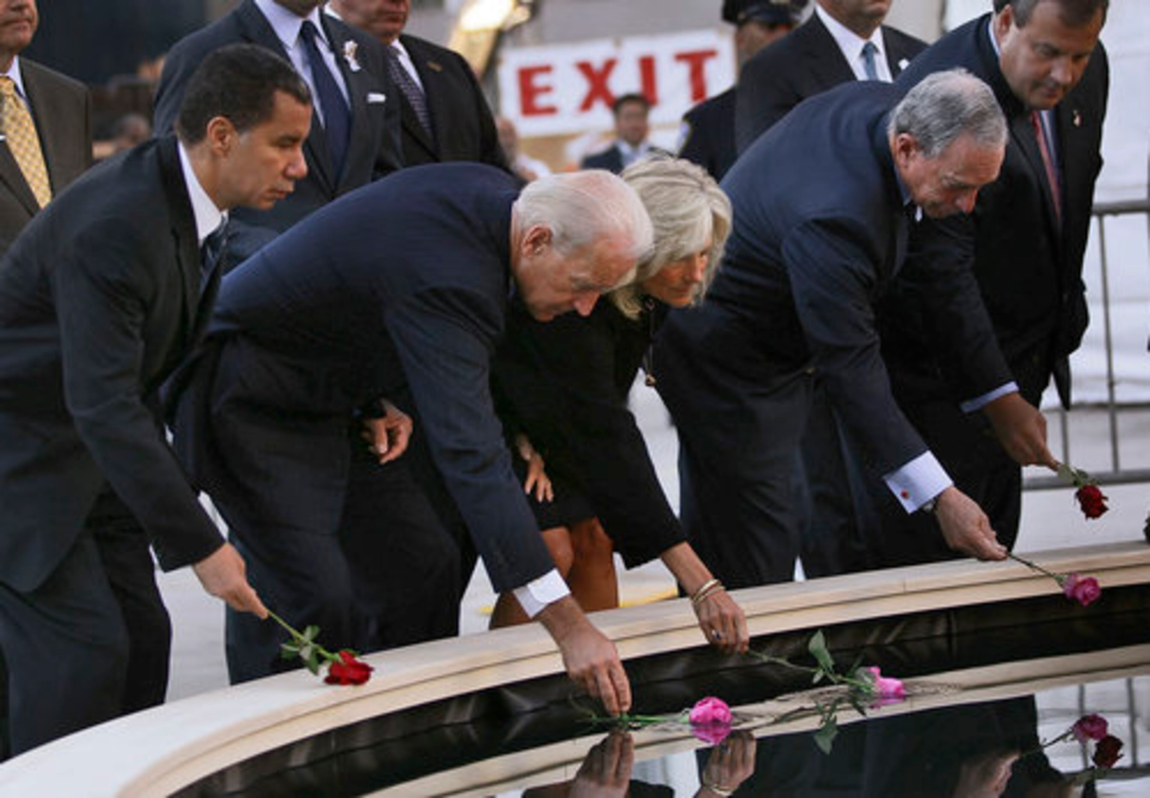 New York Gov. David Paterson, Vice President Joe Biden, his wife, Jill Biden, New York Mayor Michael Bloomberg and New Jersey Gov. Chris Christie drop flowers into a reflecting pool.