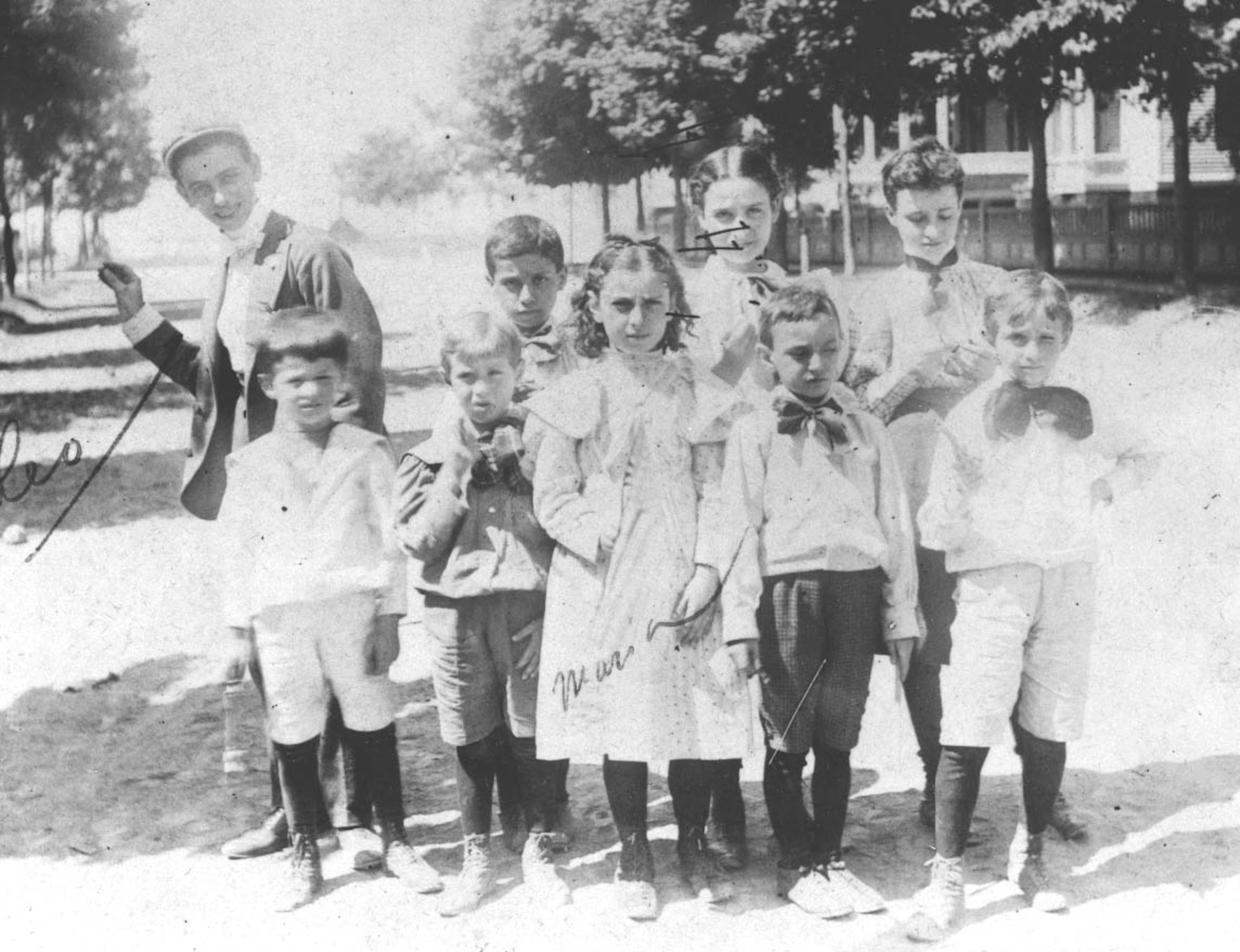 Frank (back row, far left) and sister Marian (front row, center) pose with childhood friends in Brooklyn, 1894.