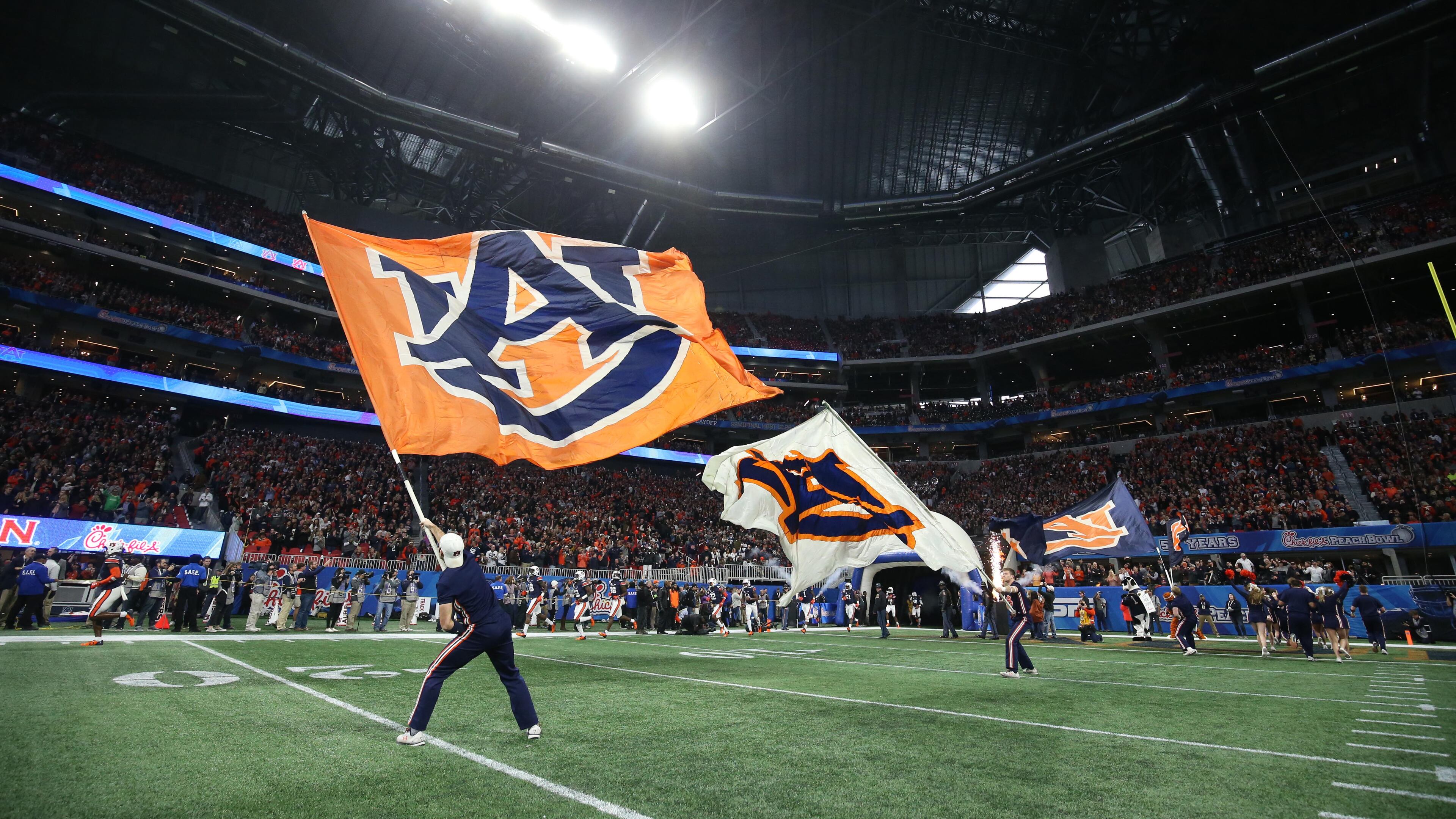 Auburn Tigers flags rally up the crowd before Auburn's game against the UCF Knights during the Chick-fil-A Peach Bowl at the Mercedes-Benz Stadium Monday, Jan. 1, 2018, in Atlanta.