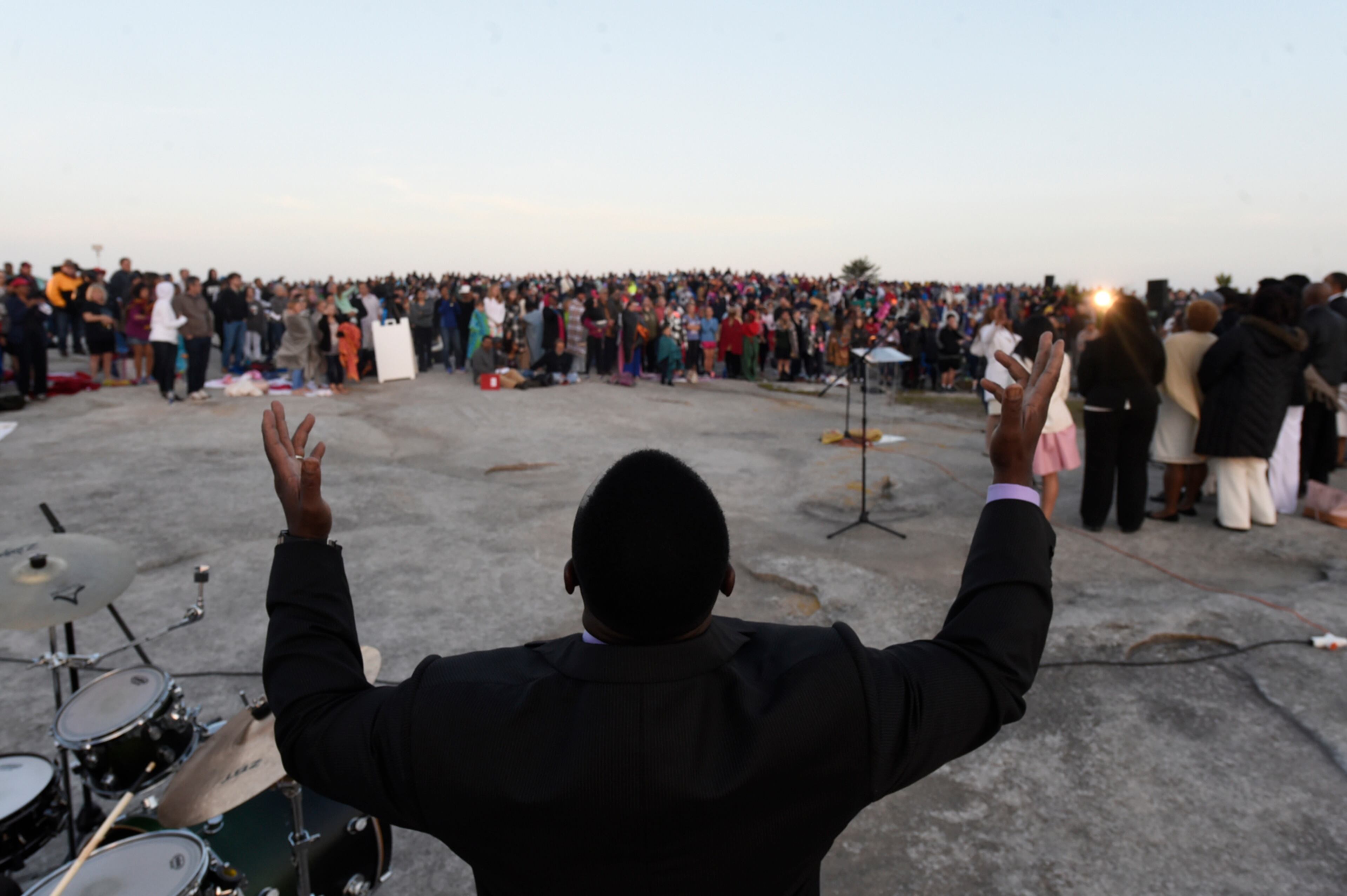 April 16, 2017, Atlanta, Georgia - Reverend Robert Hutchinson of the For Eternity Christian Church raises his hands in praise at the Easter Sunrise Service at Stone Mountain Park in Stone Mountain, Georgia, on April 16, 2017. (HENRY TAYLOR / HENRY.TAYLOR@AJC.COM)