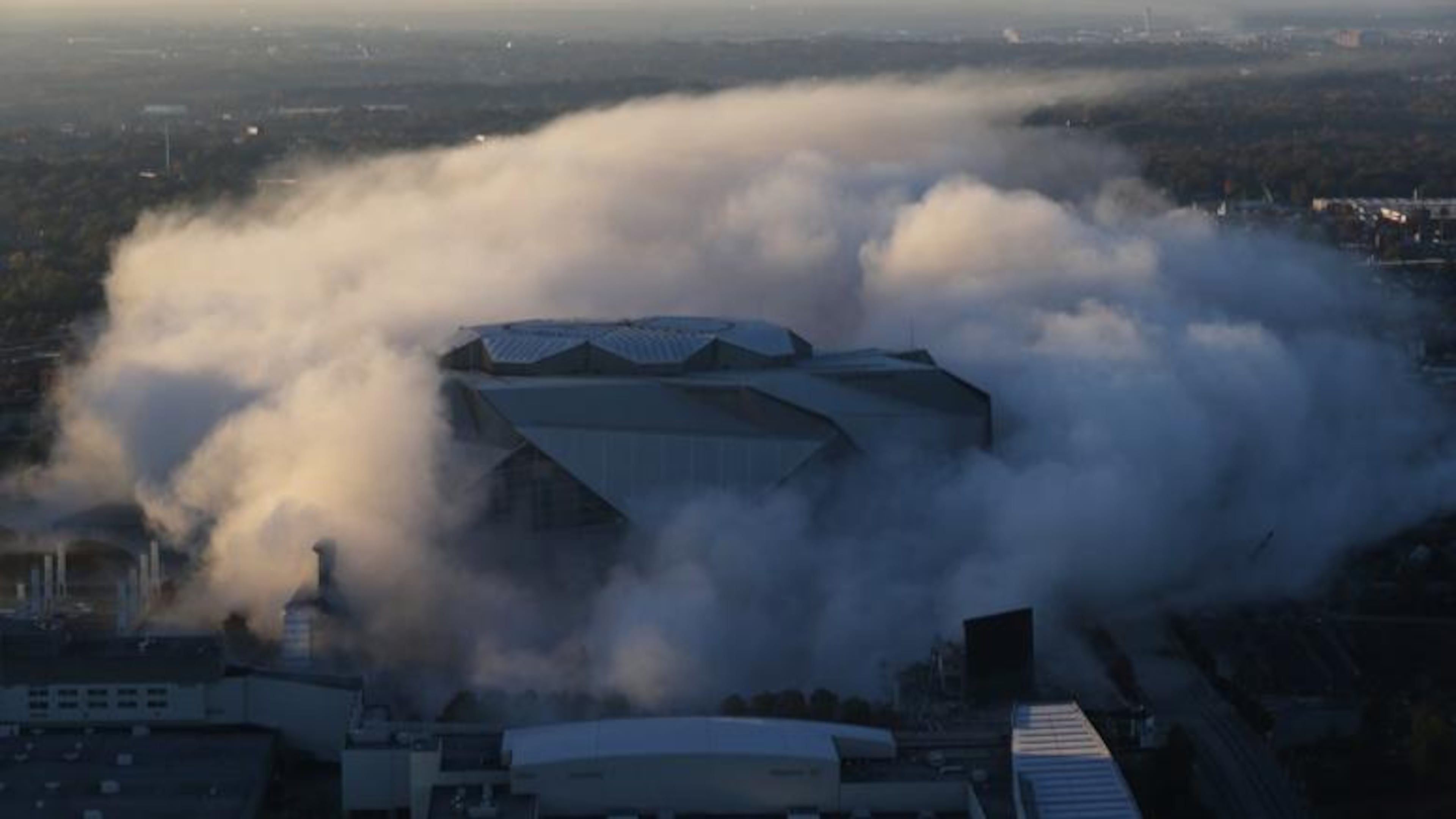 A cloud of dust is all that remains as explosives bring down the Georgia Dome Monday, Nov. 20, 2017, in Atlanta.