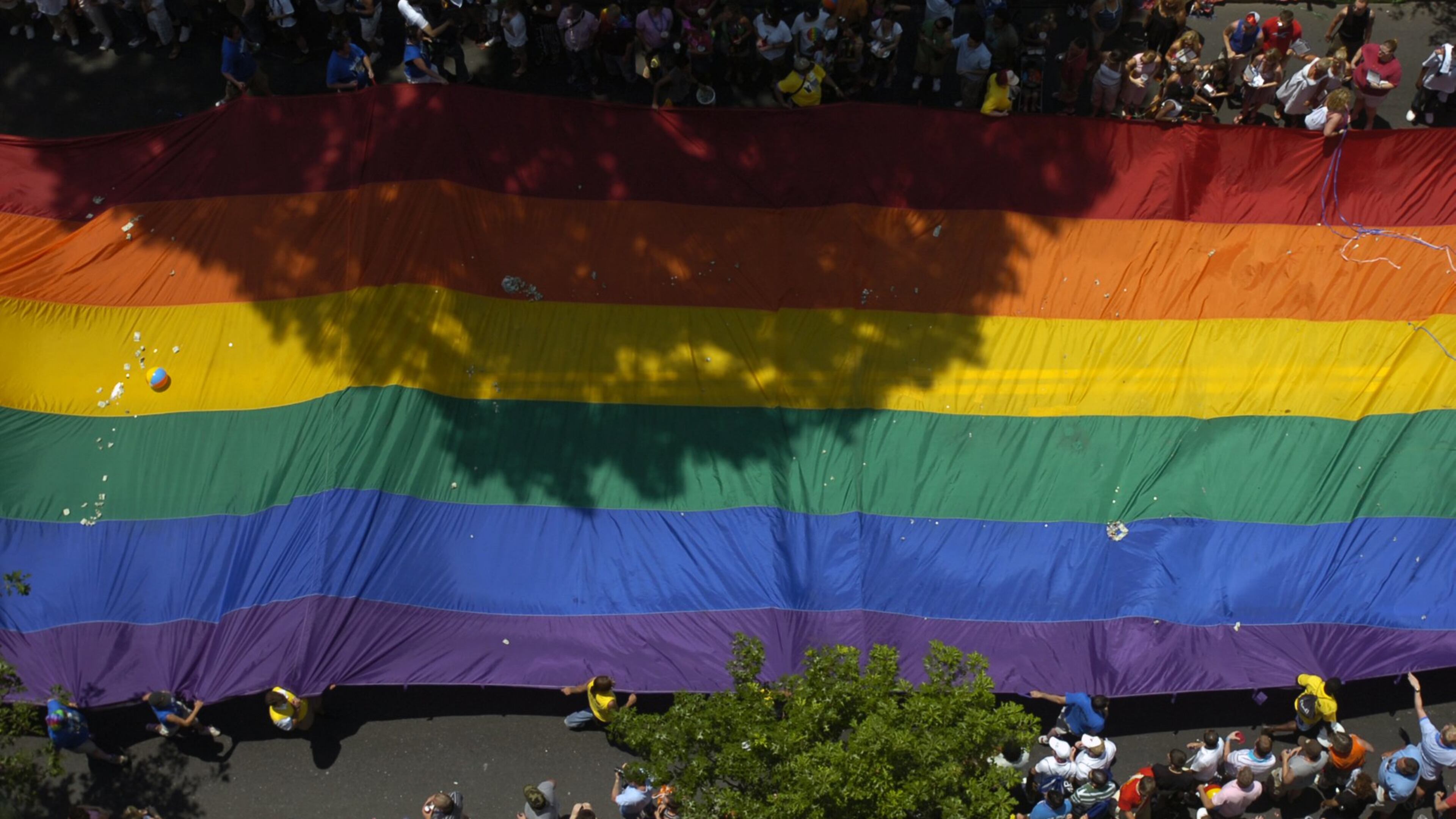 The rainbow gay PRIDE flag is carried down Peachtree Street during the 2007 PRIDE parade in Atlanta. (ELISSA EUBANKS/AJC staff)
