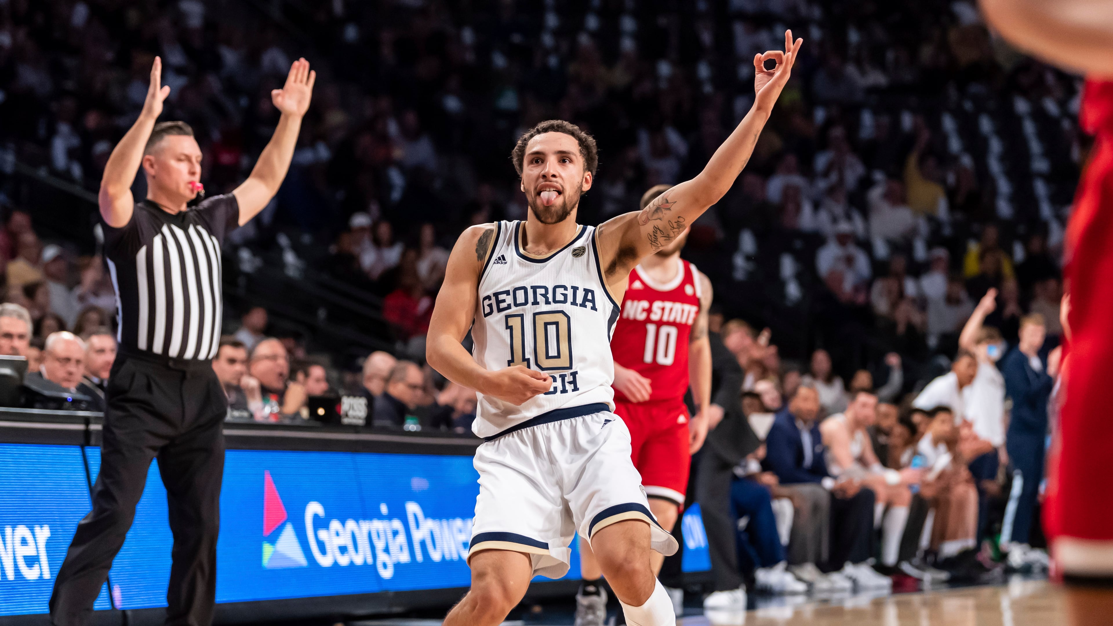 Break out the air guitar, Georgia Tech guard Jose Alvarado enjoys himself against North Carolina State in January. (AP Photo/Danny Karnik)