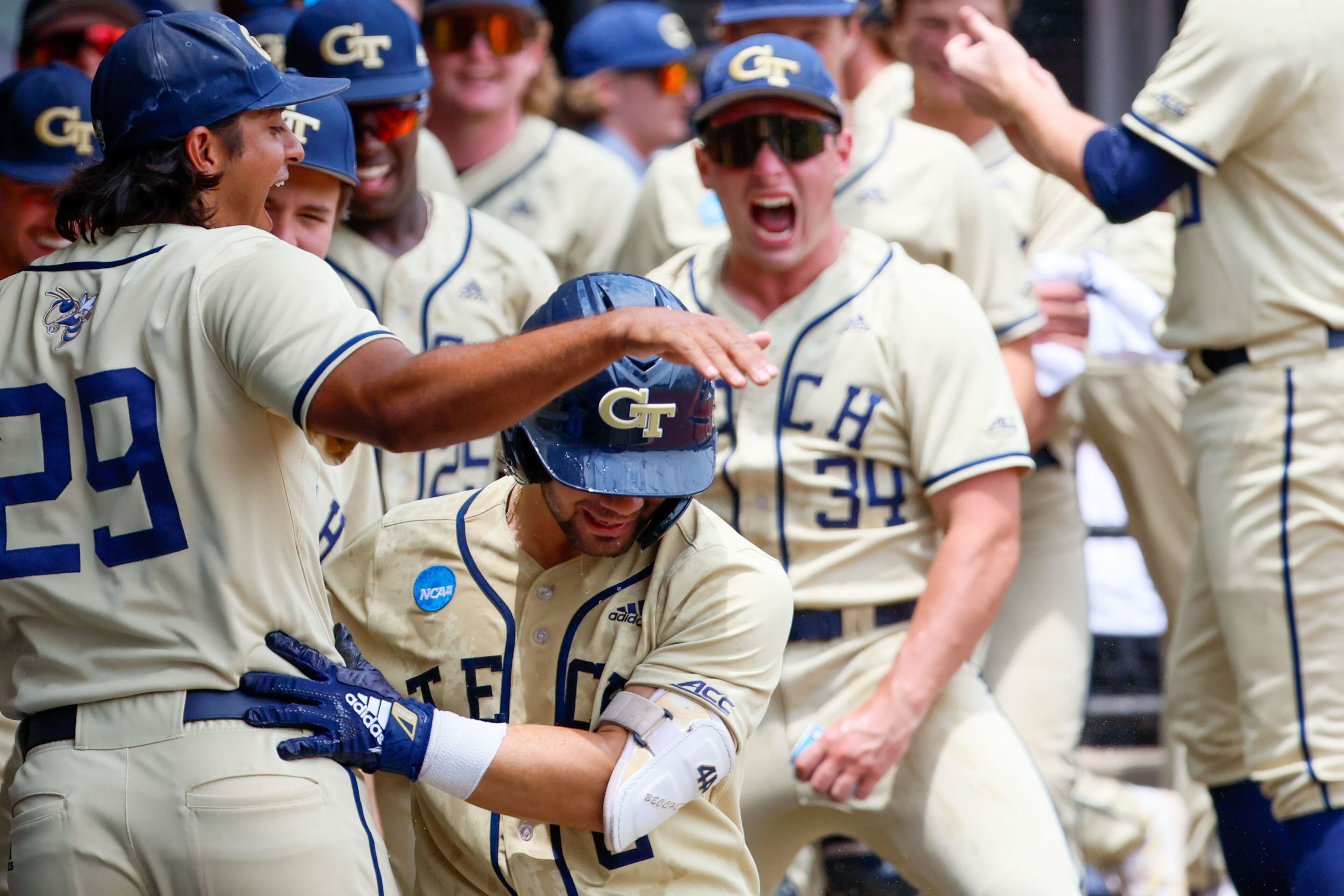 Georgia Tech players celebrate with Mike Becchetti after hitting a two-run home run in the fourth inning against UNC Wilmington during the NCAA Tournament Regional at Foley Field on Sunday, June 2, 2024, in Athens.
(Miguel Martinez / AJC)