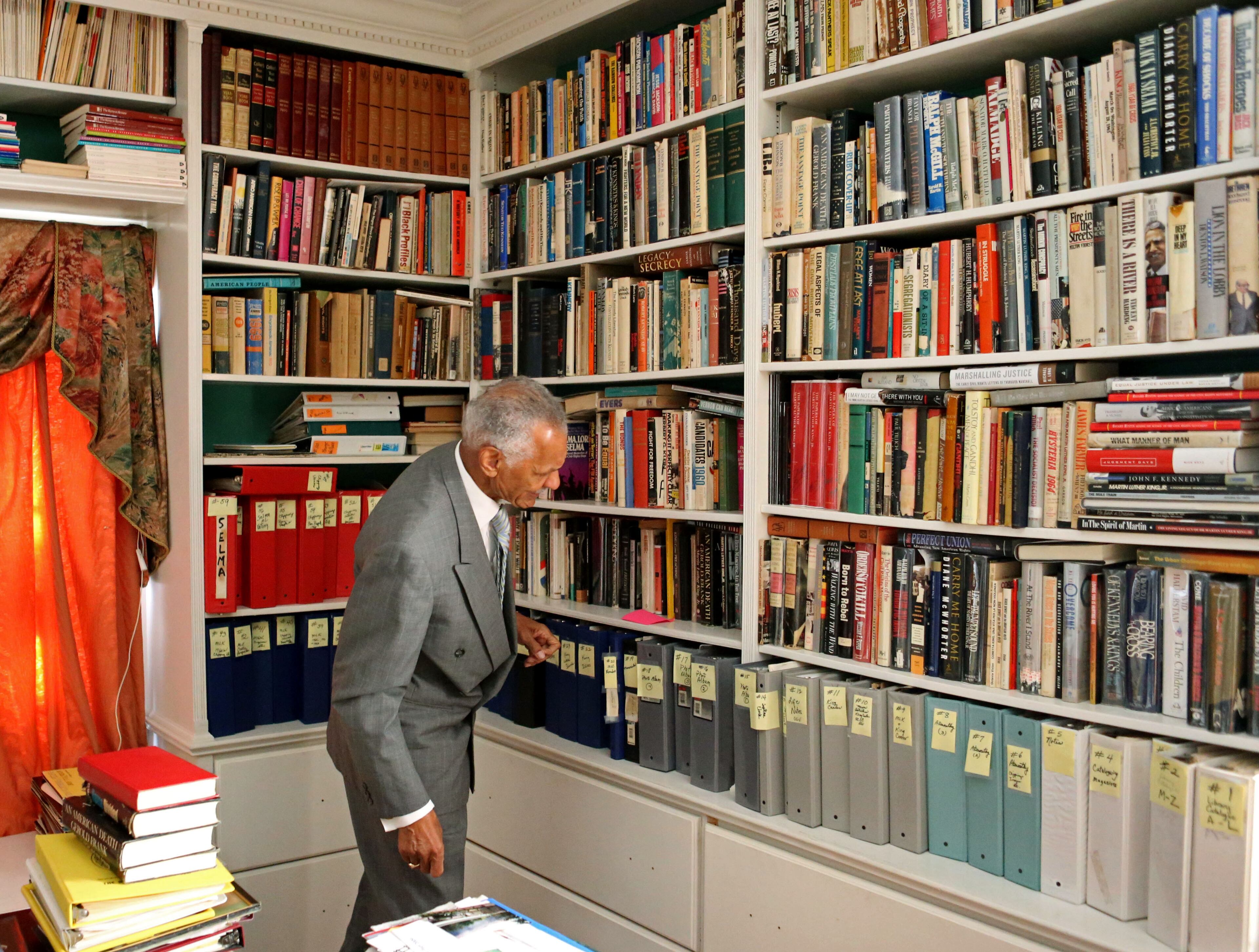 Rev. C.T. Vivian looks through his library at his home Tuesday afternoon in Atlanta, Ga., October 1, 2013. Vivian is a minister, author, and was a close friend and lieutenant of Reverend Martin Luther King, Jr. during the American Civil Rights Movement. On August 8, 2013, President Barack Obama named Rev. Vivian as a recipient of the Presidential Medal of Freedom. He's still the firebrand who stood toe to toe with the sheriff in Selma. JASON GETZ / JGETZ@AJC.COM