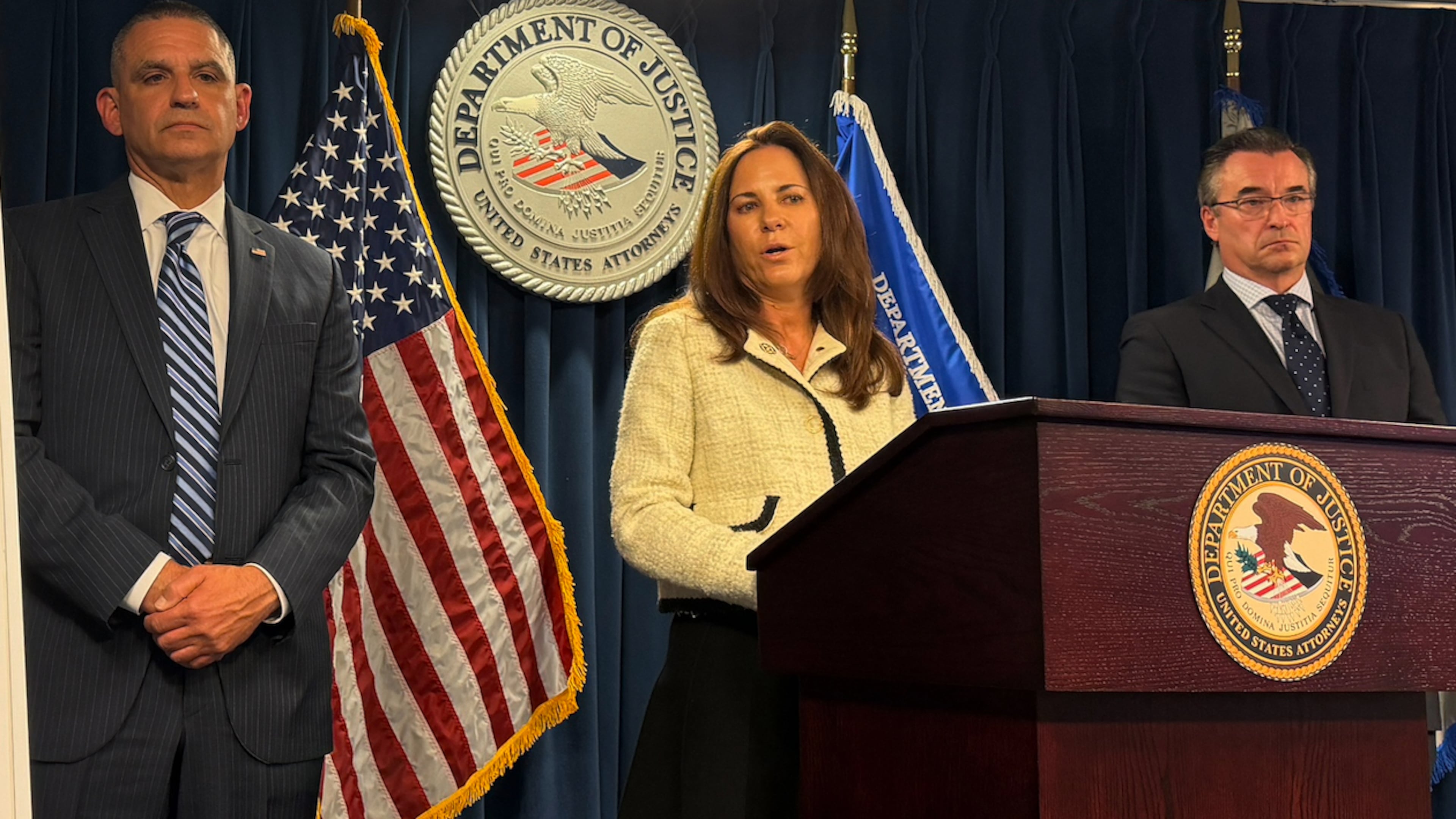 U.S. Attorney Leah Foley is joined by John Soars, assistant special agent in charge Homeland Security Investigations in New England and Shawn Saucier, Northeast Regional Chief, U.S. Citizenship and Immigration Services, to announce the arrest of six people for allegedly arranging sham marriages over the past decade that netted them millions of dollars during a news conference on Wednesday, Oct. 21, 2025 in Boston. (AP Photo/Michael Casey)