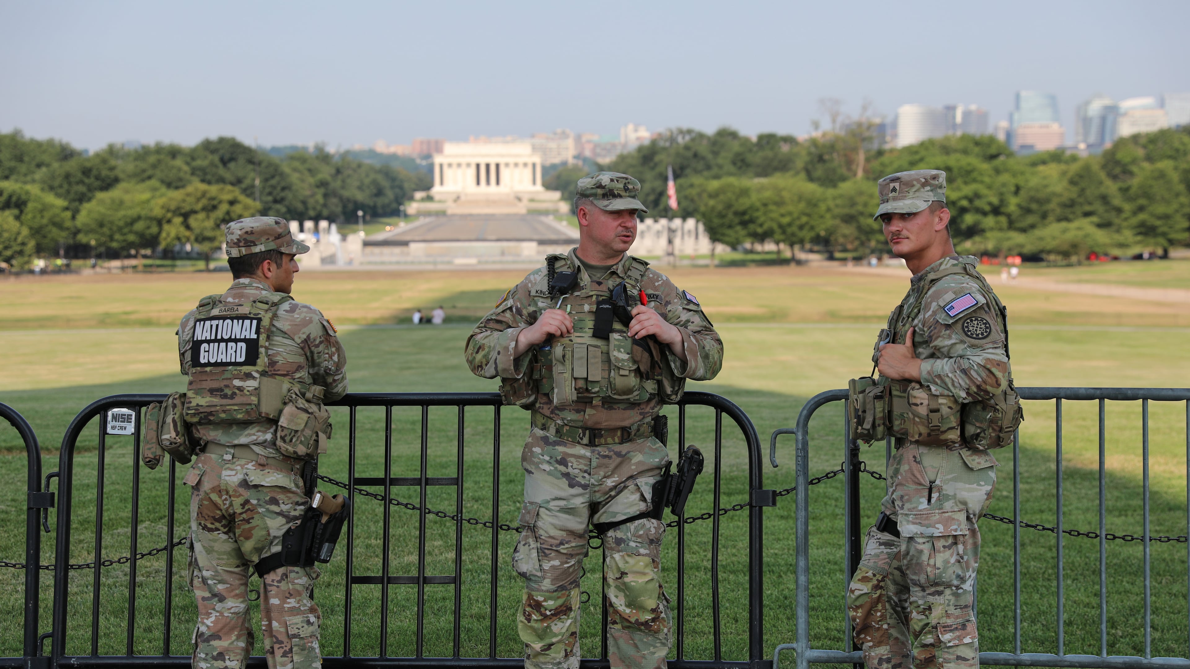 Member of the National Guard patrol at the base of the Washington Monument, Wednesday, July 15, 2026, in Washington. The Lincoln Memorial is in the background, (AP Photo/Rahmat Gul)