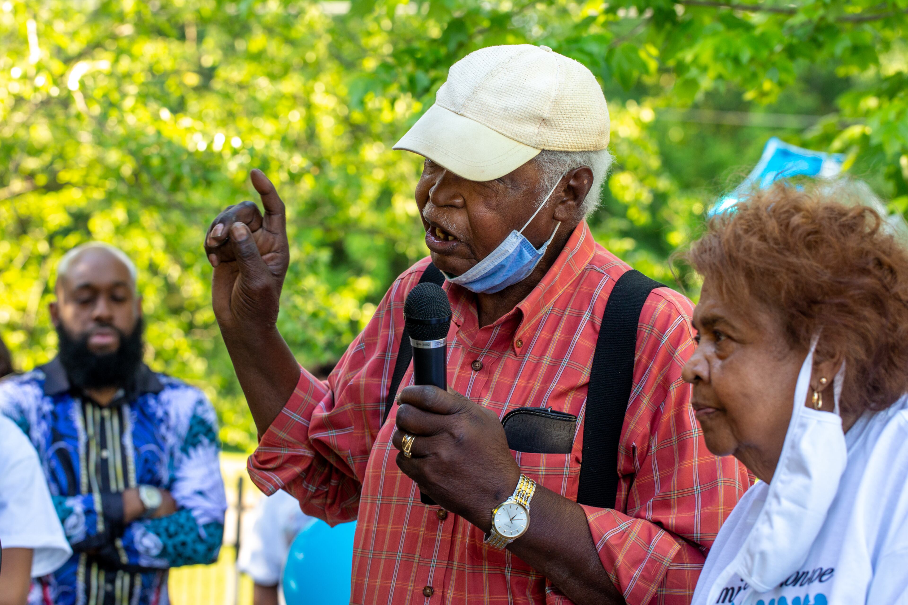 Family and friends of Normisha “MiMi” Monroe gather Saturday, May 1, 2021, at Club Drive Park in Lawrenceville to celebrate the life of the 38-year-old, who died along with five other women in a passenger van crash on I-85 a week earlier. James and Carolyn Subar speak briefly about Monroe, whom they raised after her mother died. (Photo: Jenni Girtman for The Atlanta Journal-Constitution)