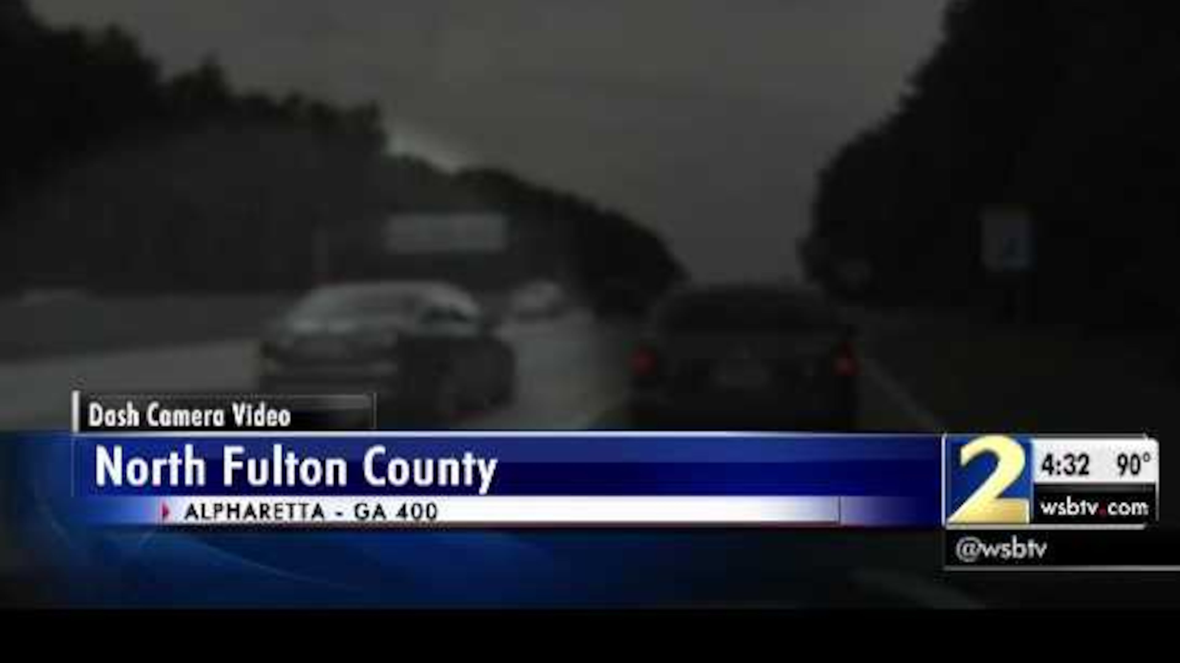 Dash cam video shows a woman not moving over a lane as a police officer was making a traffic stop.