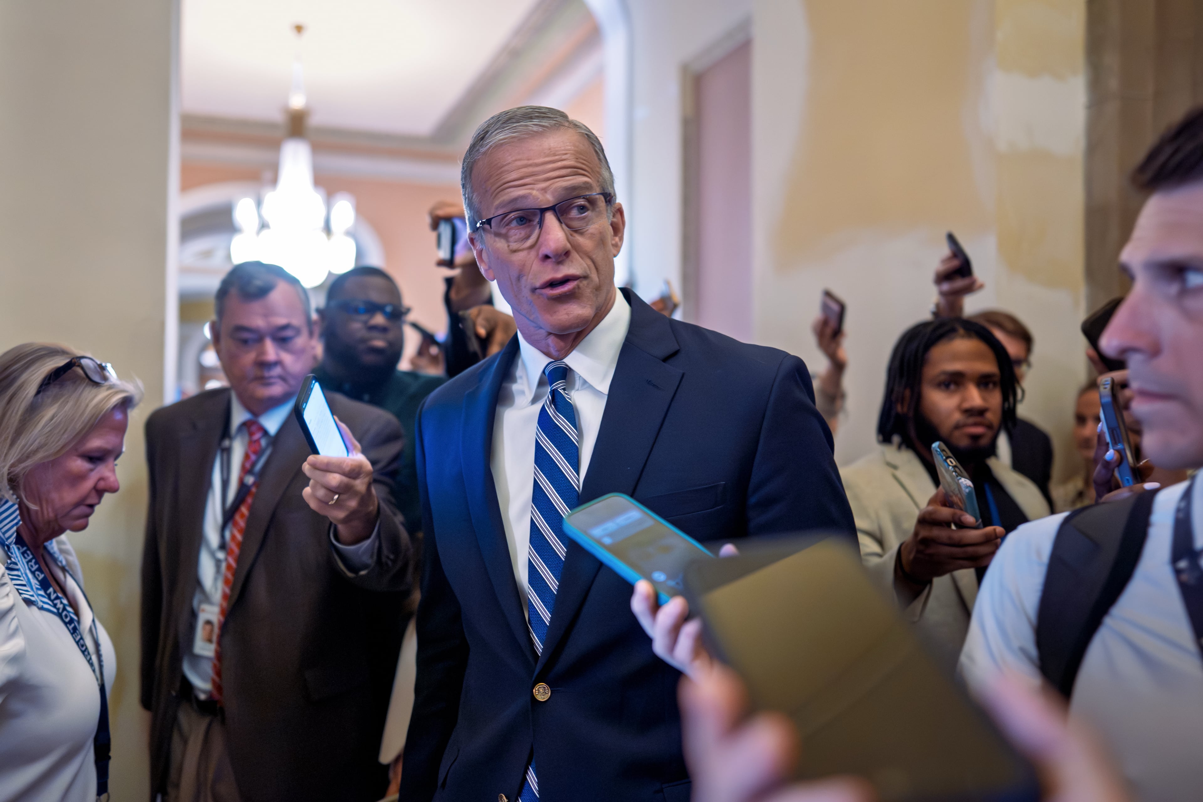 Senate Majority Leader John Thune, R-S.D., pauses for questions from reporters before voting on the immigration enforcement funding package at the Capitol in Washington on Thursday. (J. Scott Applewhite/AP)
