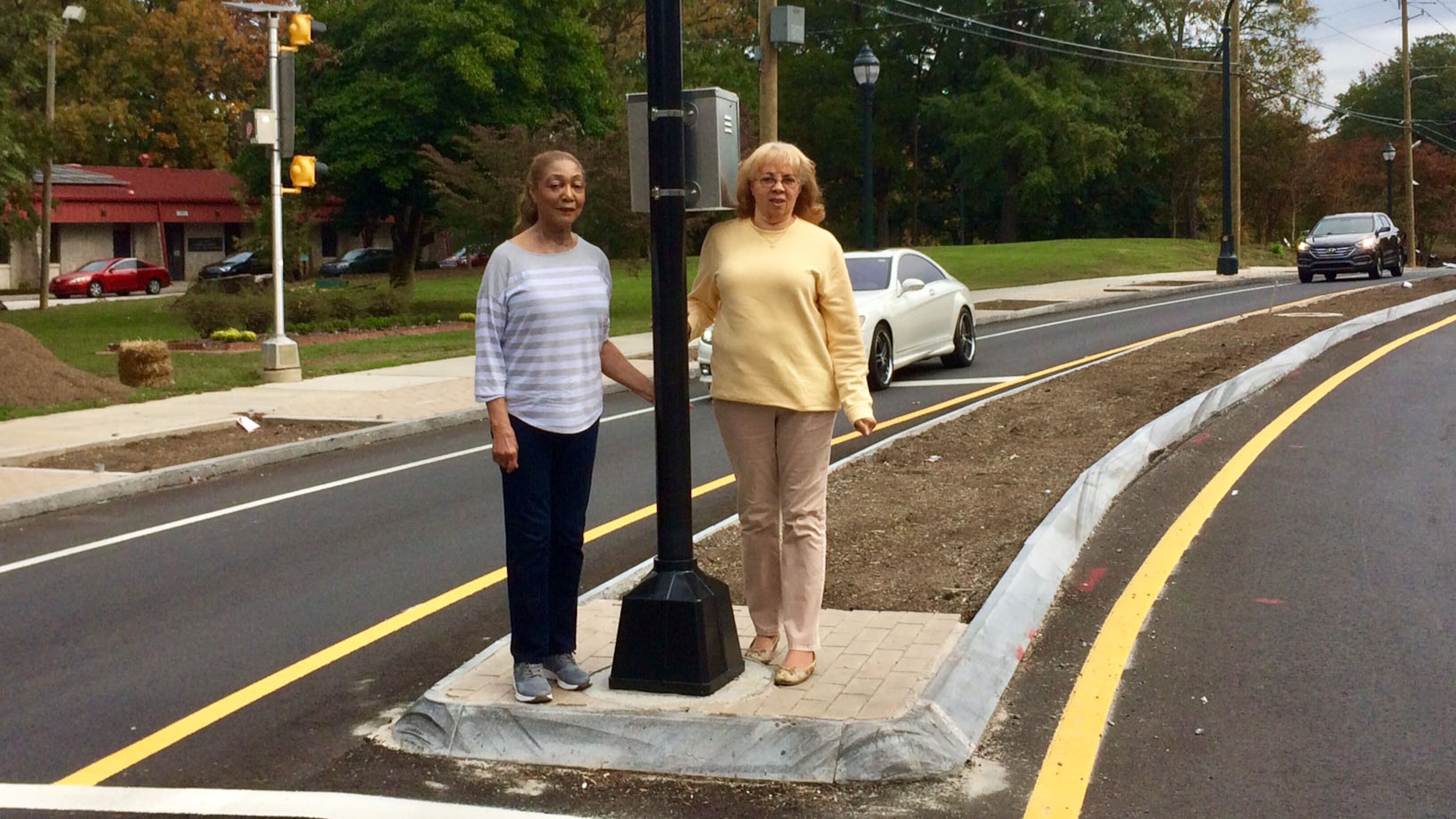 Jackye Rhodes (left), and Chris Lloyd have been asking the city to rework its efforts on traffic calming along Martin Luther King Jr. Dr. (Photo by Bill Torpy)