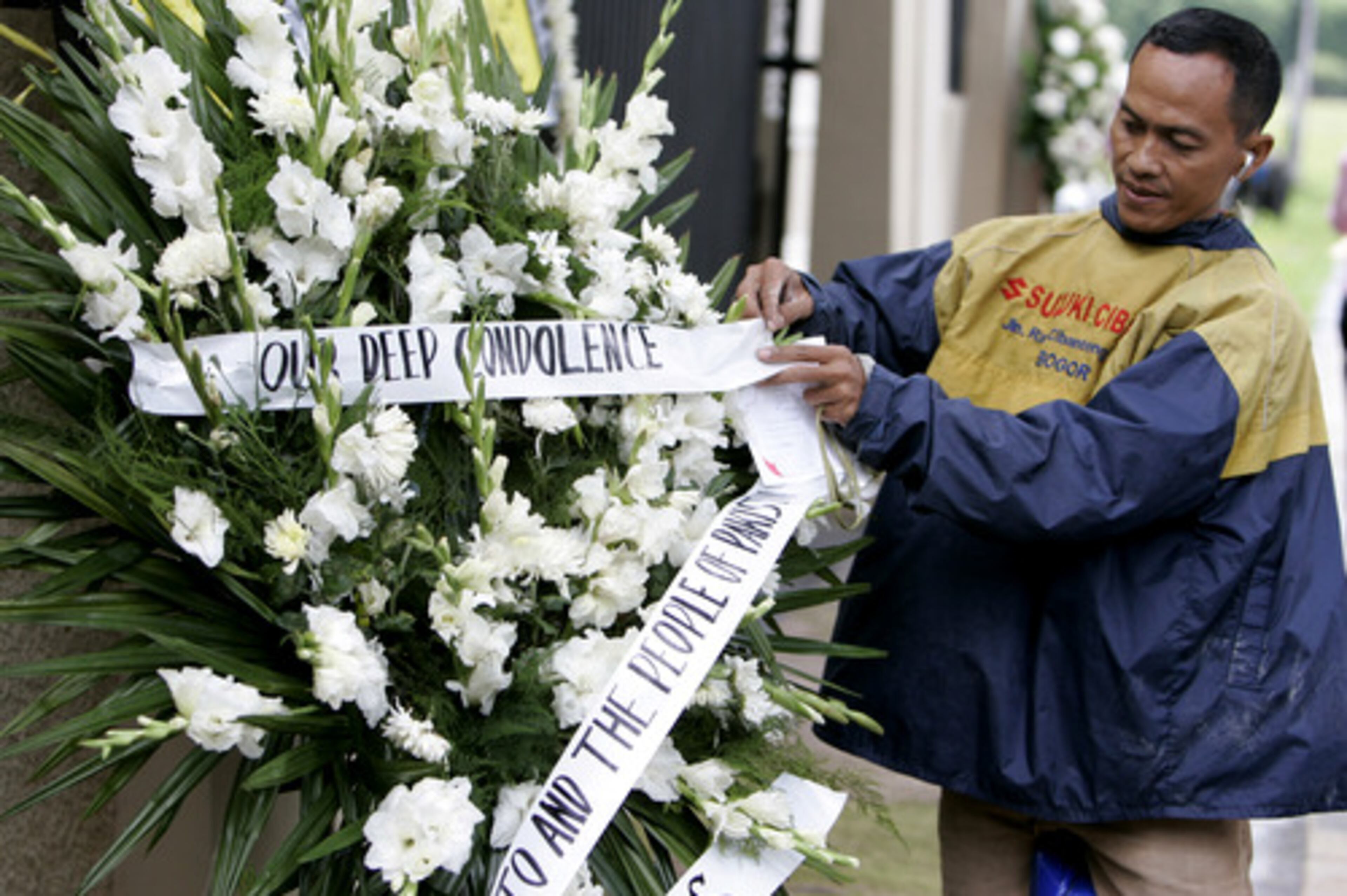 An Indonesia courier sets up a wreath for former Pakistani Prime Minister Benazir Bhutto at the Pakistan Embassy in Jakarta, Indonesia, on Friday.