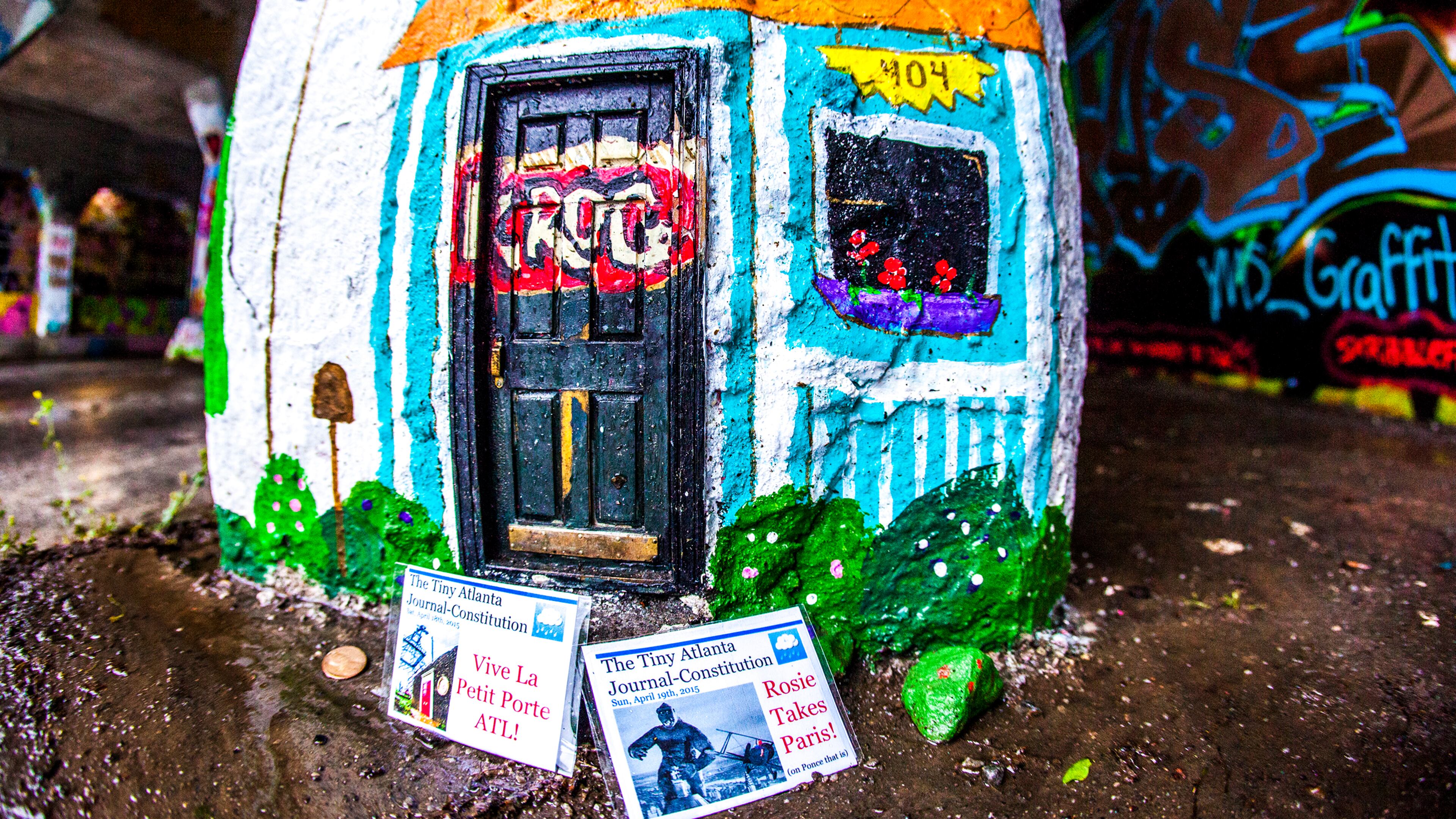 Two editions of The Tiny Atlanta Journal-Constitution, printed by an Atlanta man going by the psuedonym "Scoop Callahan."