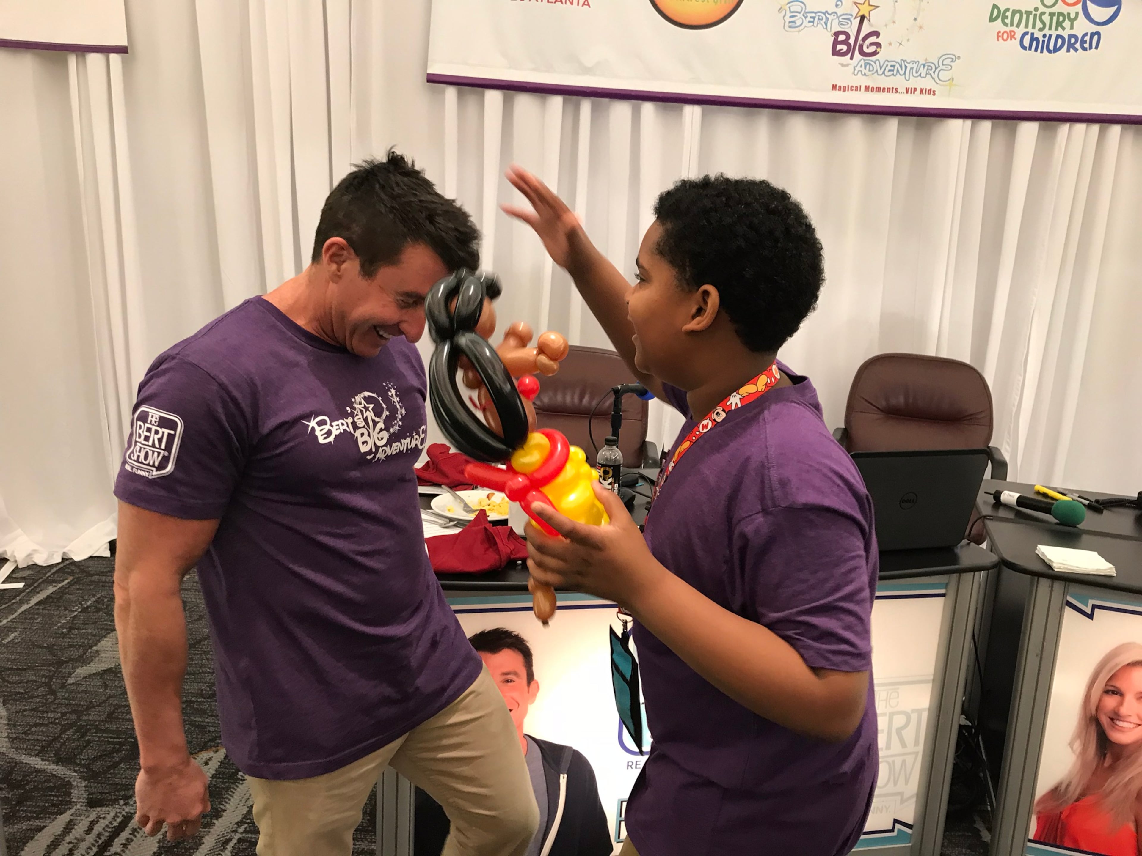 Weiss goofs around with Zy Fagin, a Bert's Big Adventure participant, who has had a brain aneurysm. (Rodney Ho/AJC)