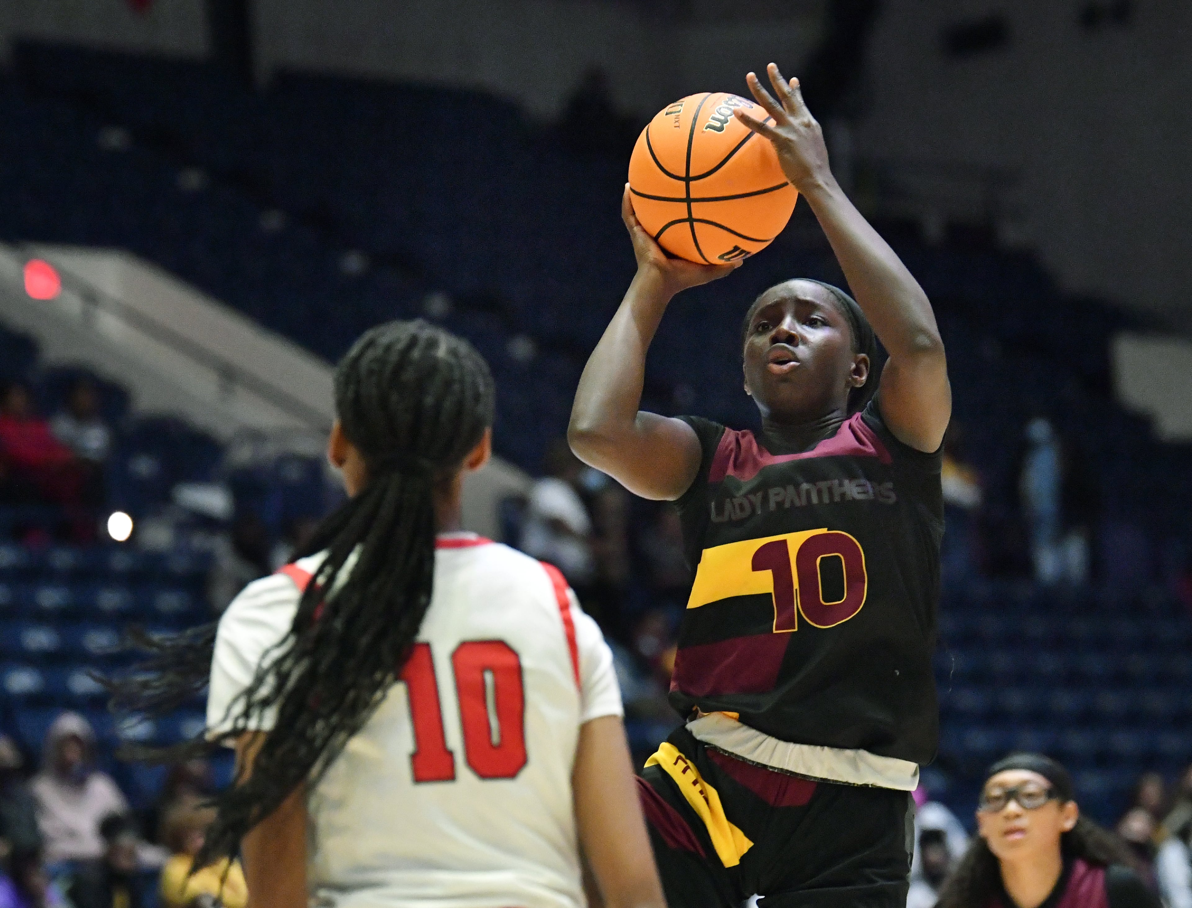 Forest Park's Jayda Brown (10) shoots over Woodward Academy's Kameron Herring (10) during the 2022 GHSA State Basketball Class AAAAA Girls Championship game at the Macon Centreplex in Macon on Thursday, March 10, 2022. (Hyosub Shin / Hyosub.Shin@ajc.com)