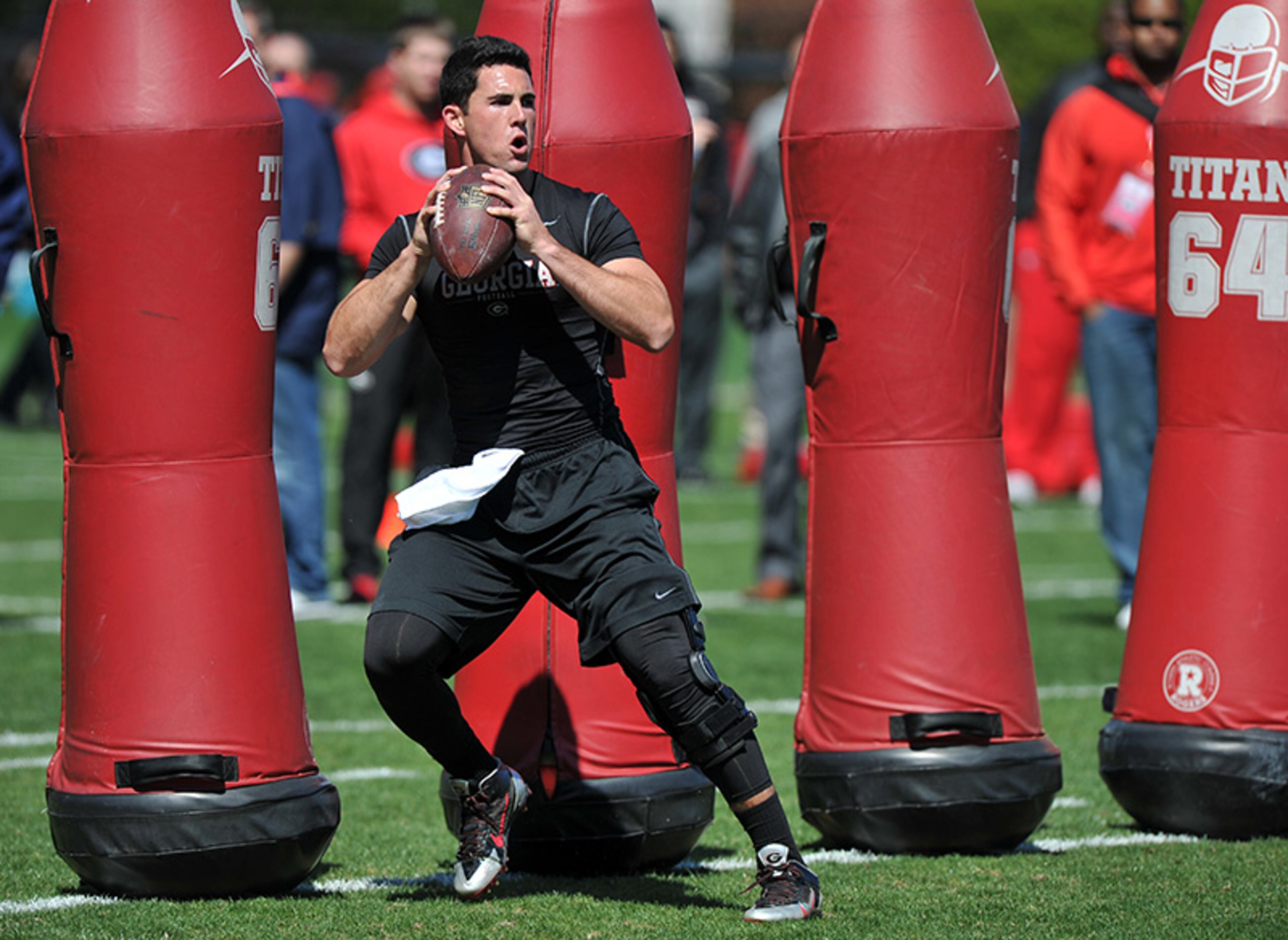 Former Georgia quarterback Aaron Murray did not wear pads or helmets during his passing session before NFL scouts on Georgia Pro Day Wednesday, April 16, 2014, in Athens. He did, however, have a brace on his surgically repaired knee. Murray's career at Georgia ended when he left the season's next to last game with a torn ACL.