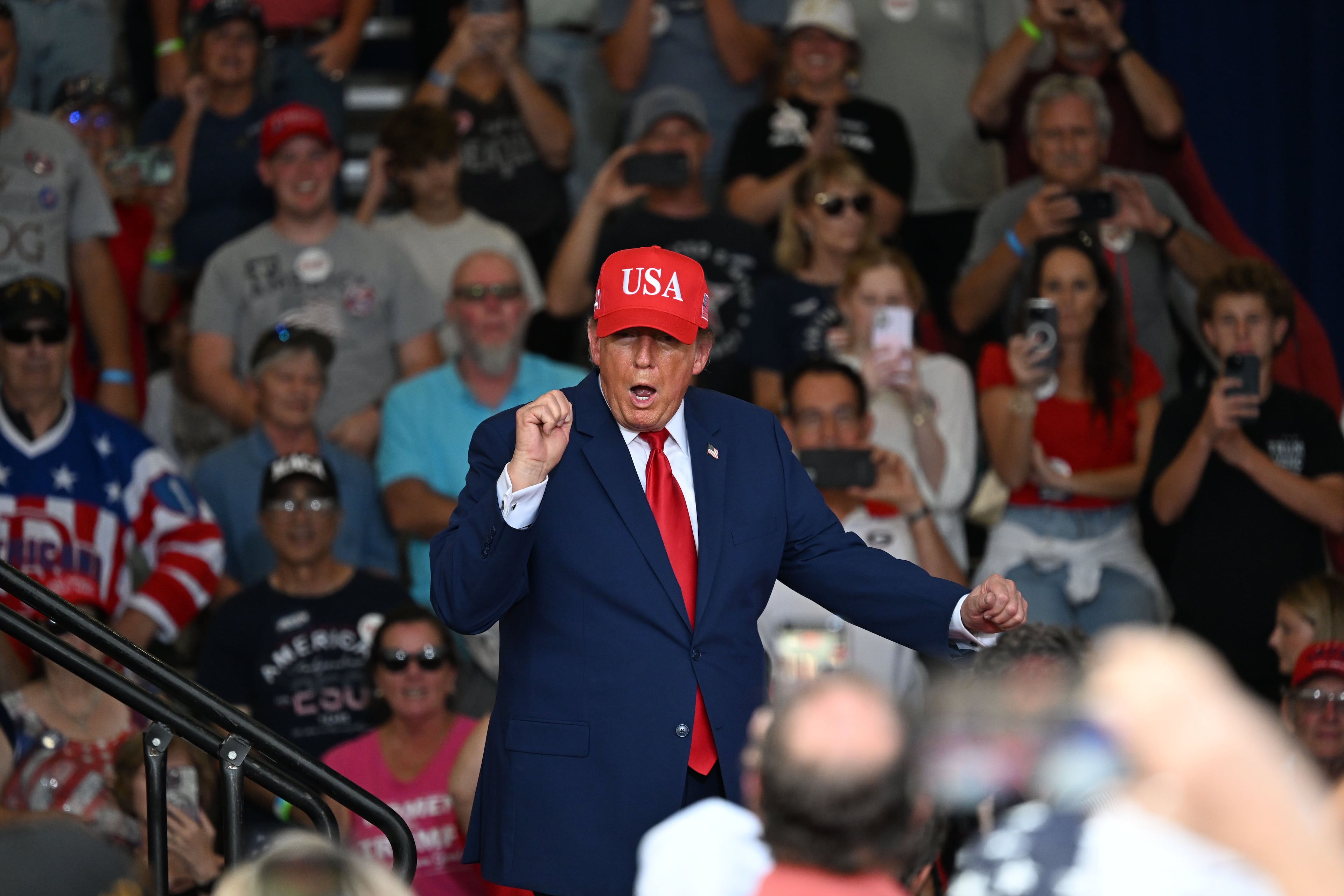 President Donald Trump dances as he leaves the stage at the end of a campaign rally at Dalton Municipal Airport on Friday, Oct. 16, 2026, in Dalton. President Donald Trump is heading to deep-red Dalton on Friday for a campaign rally aimed at firing up Republicans less than three weeks before Election Day. (Hyosub Shin/AJC)