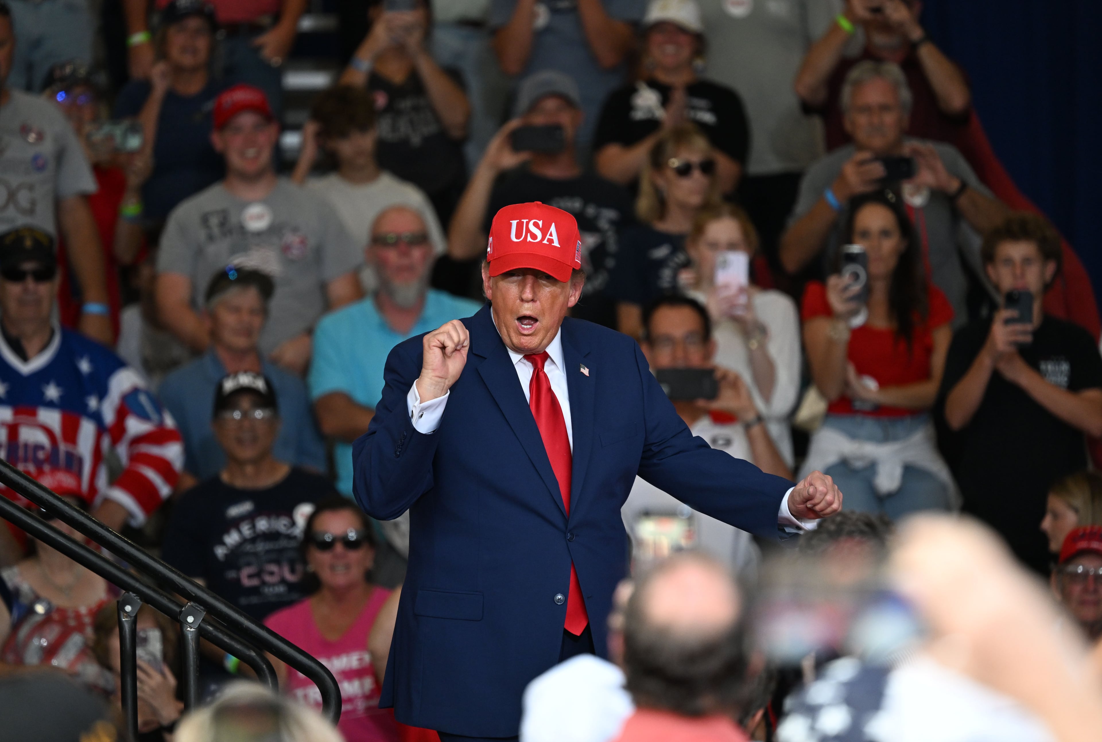 President Donald Trump dances as he leaves the stage at the end of a campaign rally at Dalton Municipal Airport on Friday, Oct. 16, 2026, in Dalton. (Hyosub Shin/AJC)