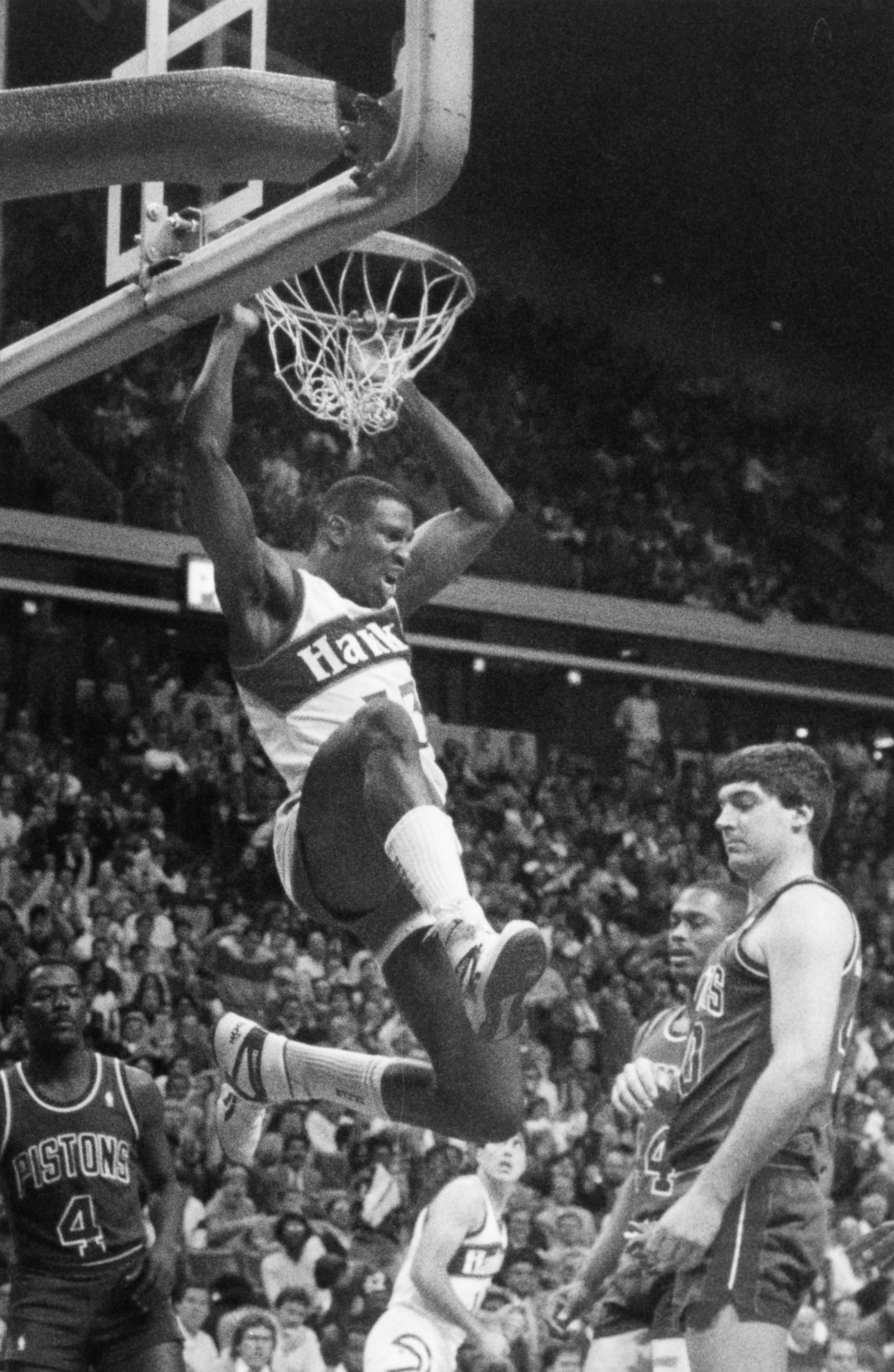 Hawks forward Cliff Levingston dunks over the Pistons in 1988. AJC file photo