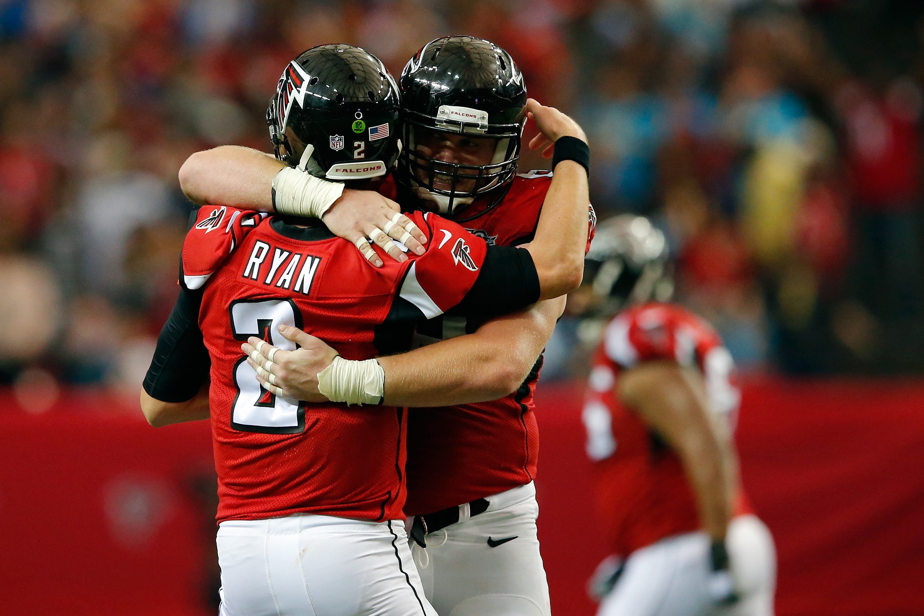 Matt Ryan #2 celebrates a touchdown pass with Mike Person #68 of the Atlanta Falcons during the second half against the Carolina Panthers at the Georgia Dome on December 27, 2015 in Atlanta, Georgia. (Photo by Kevin C. Cox/Getty Images)