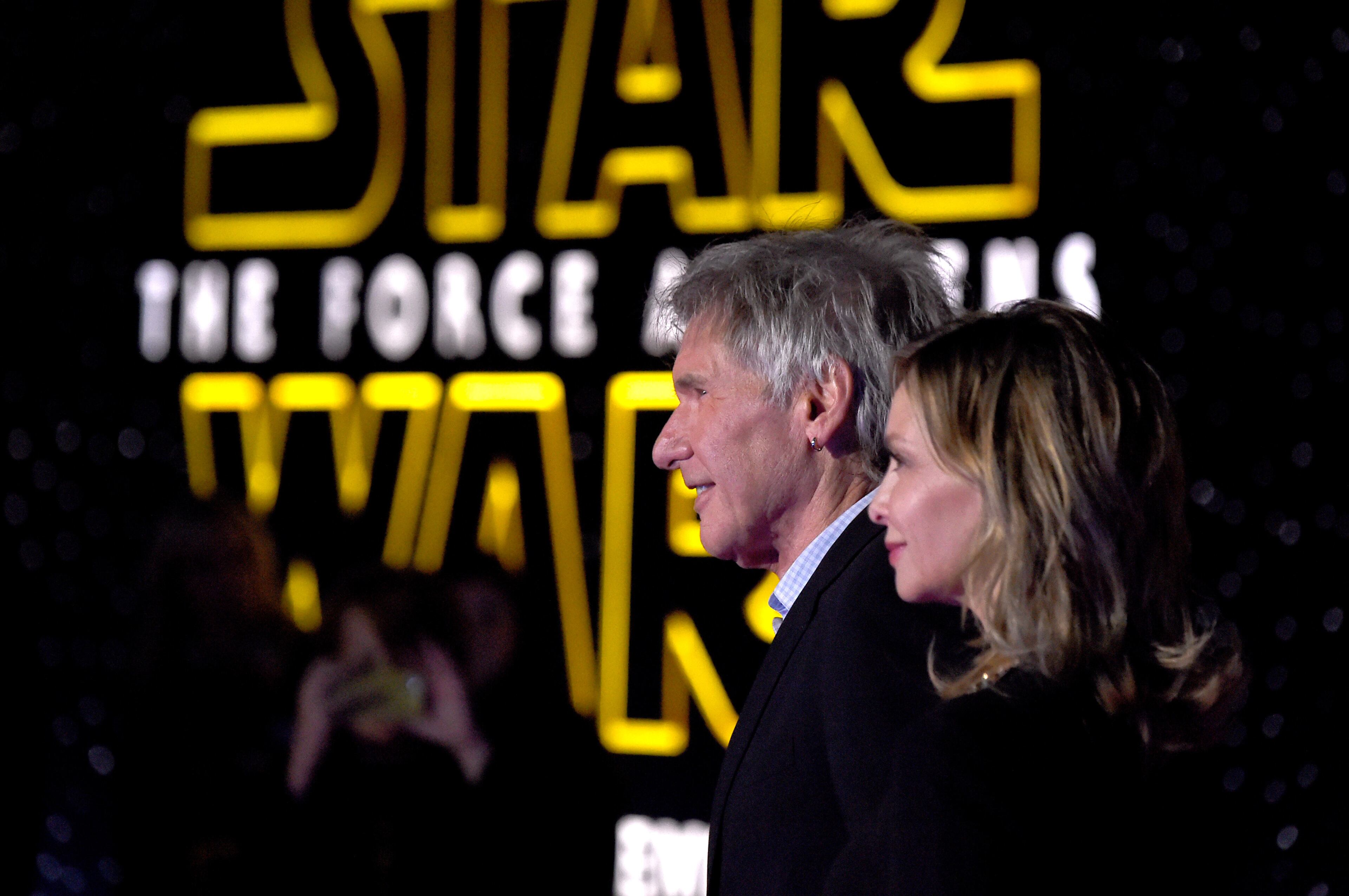 HOLLYWOOD, CA - DECEMBER 14: Actors Harrison Ford (L) and Calista Flockhart attend the Premiere of Walt Disney Pictures and Lucasfilm's "Star Wars: The Force Awakens" on December 14, 2015 in Hollywood, California. (Photo by Frazer Harrison/Getty Images)