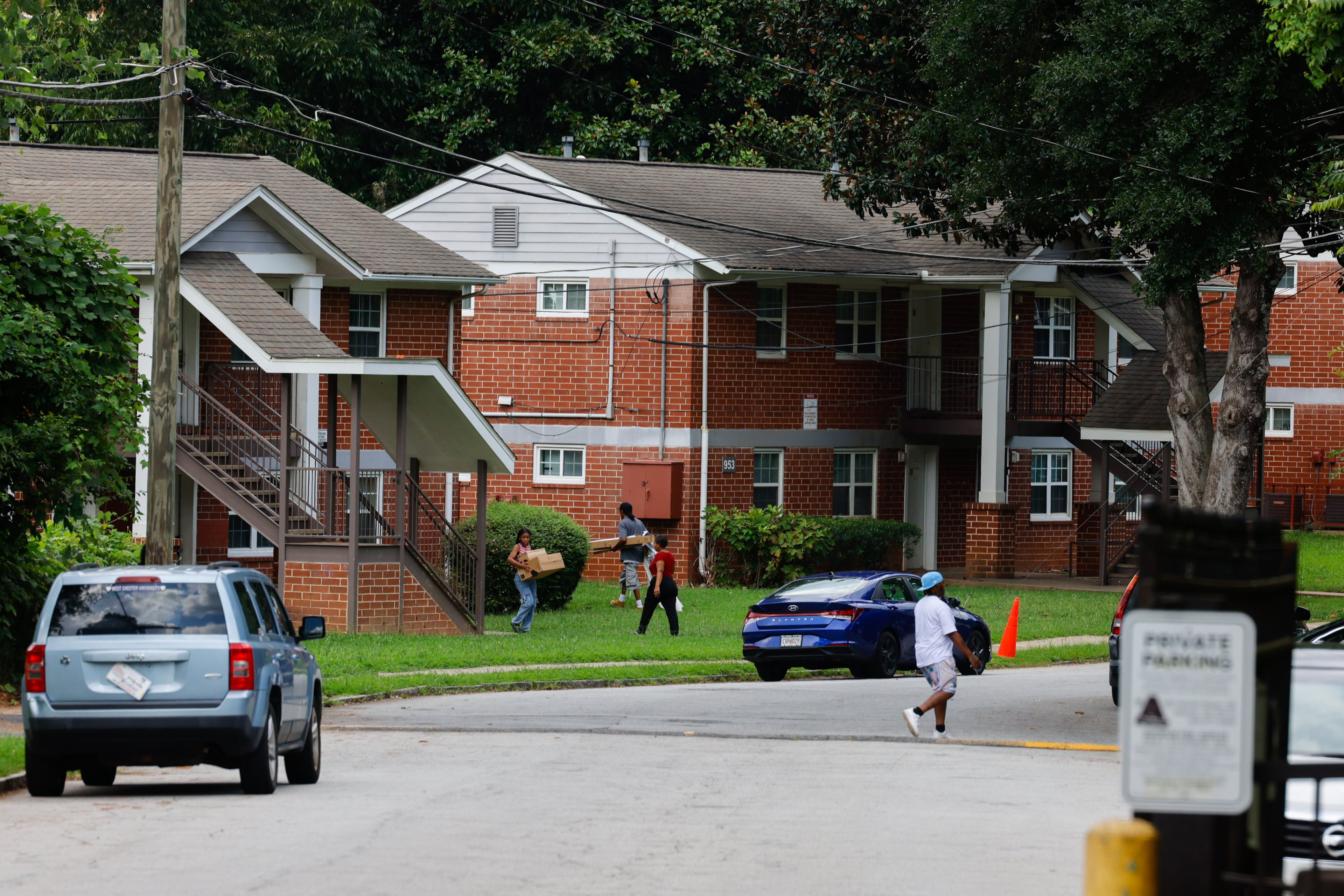 People walk through the Trestletree Village Apartments on Tuesday, Aug. 11, 2026, in Atlanta. In subsidized housing, there is little incentive to accommodate resident demands. (Arvin Temkar/AJC)