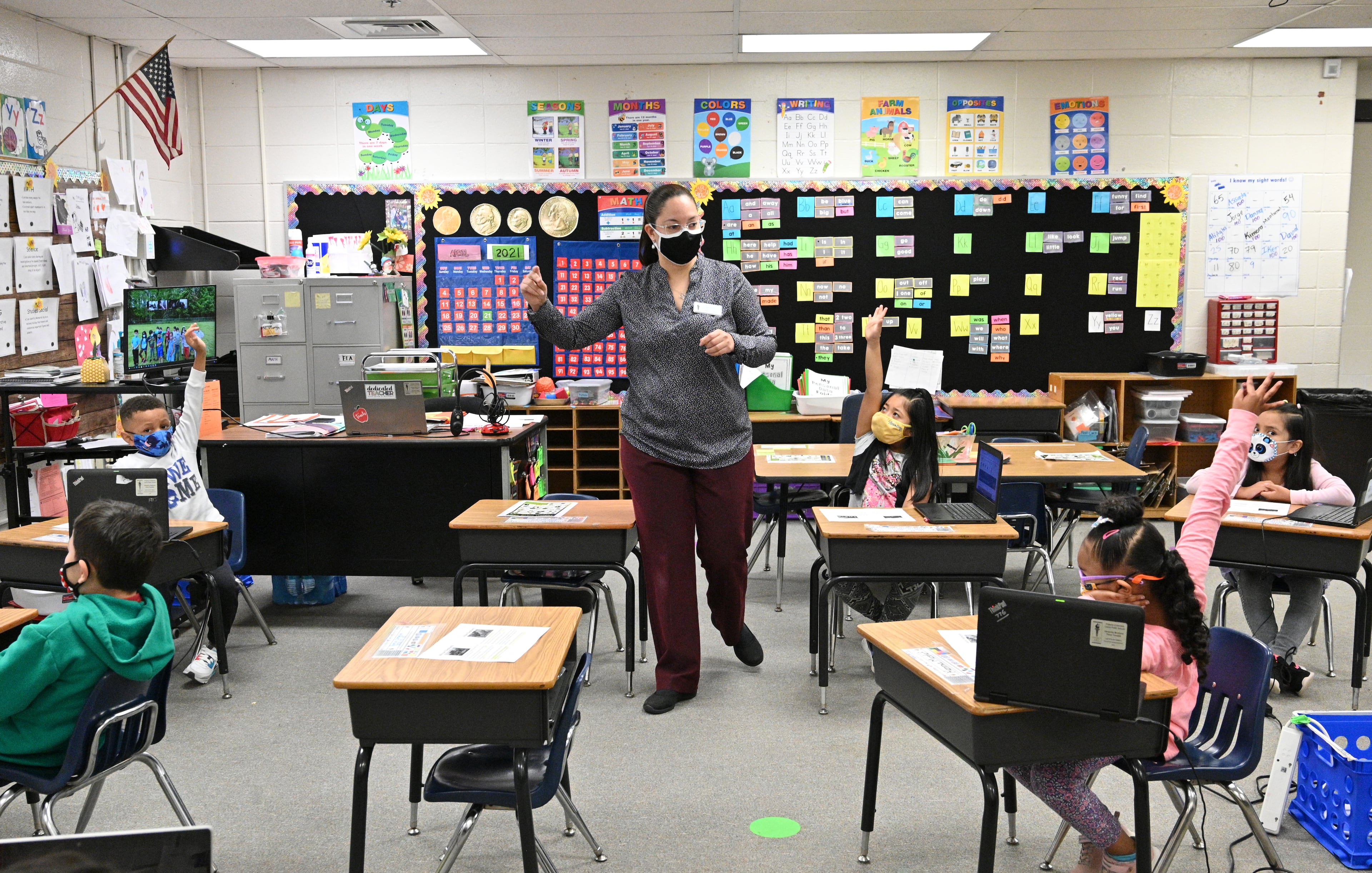 Lies Toribio, a first-year teacher who was once a custodian, teaches her kindergarten class at Bethesda Elementary in Lawrenceville on April 22, 2021. (Hyosub Shin / Hyosub.Shin@ajc.com)