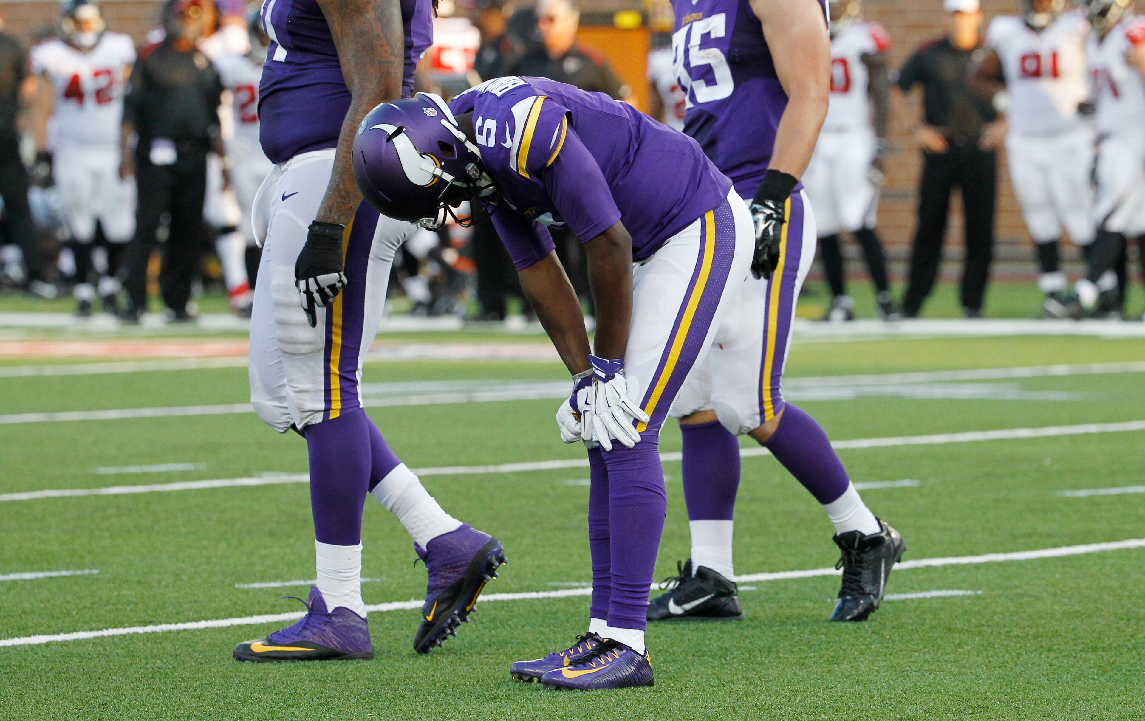 Minnesota Vikings quarterback Teddy Bridgewater (5) reacts after getting injured during the second half of an NFL football game against the Atlanta Falcons, Sunday, Sept. 28, 2014, in Minneapolis. (AP Photo/Ann Heisenfelt)