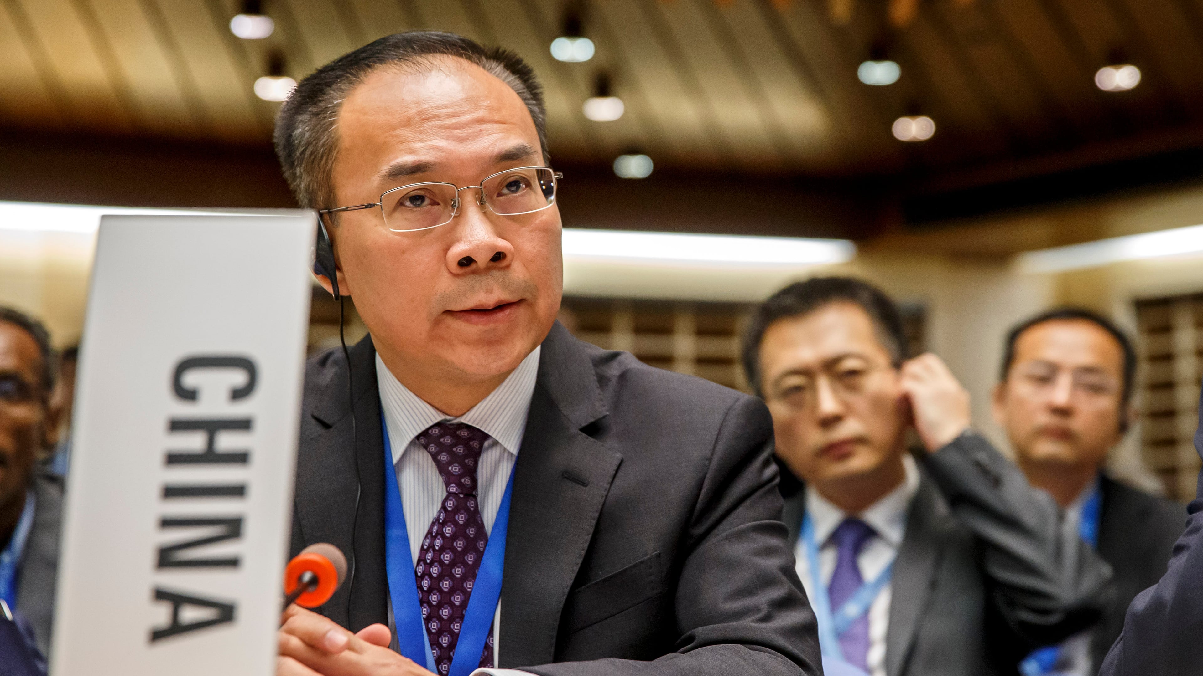FILE - China's Ambassador Song Li asks the floor after moving a placard identifying his country, during the 146th session of the World Health Organization Executive Board, at the World Health Organization (WHO) headquarters in Geneva, Switzerland, Monday, Feb. 3, 2020. (Salvatore Di Nolfi/Keystone via AP, File)
