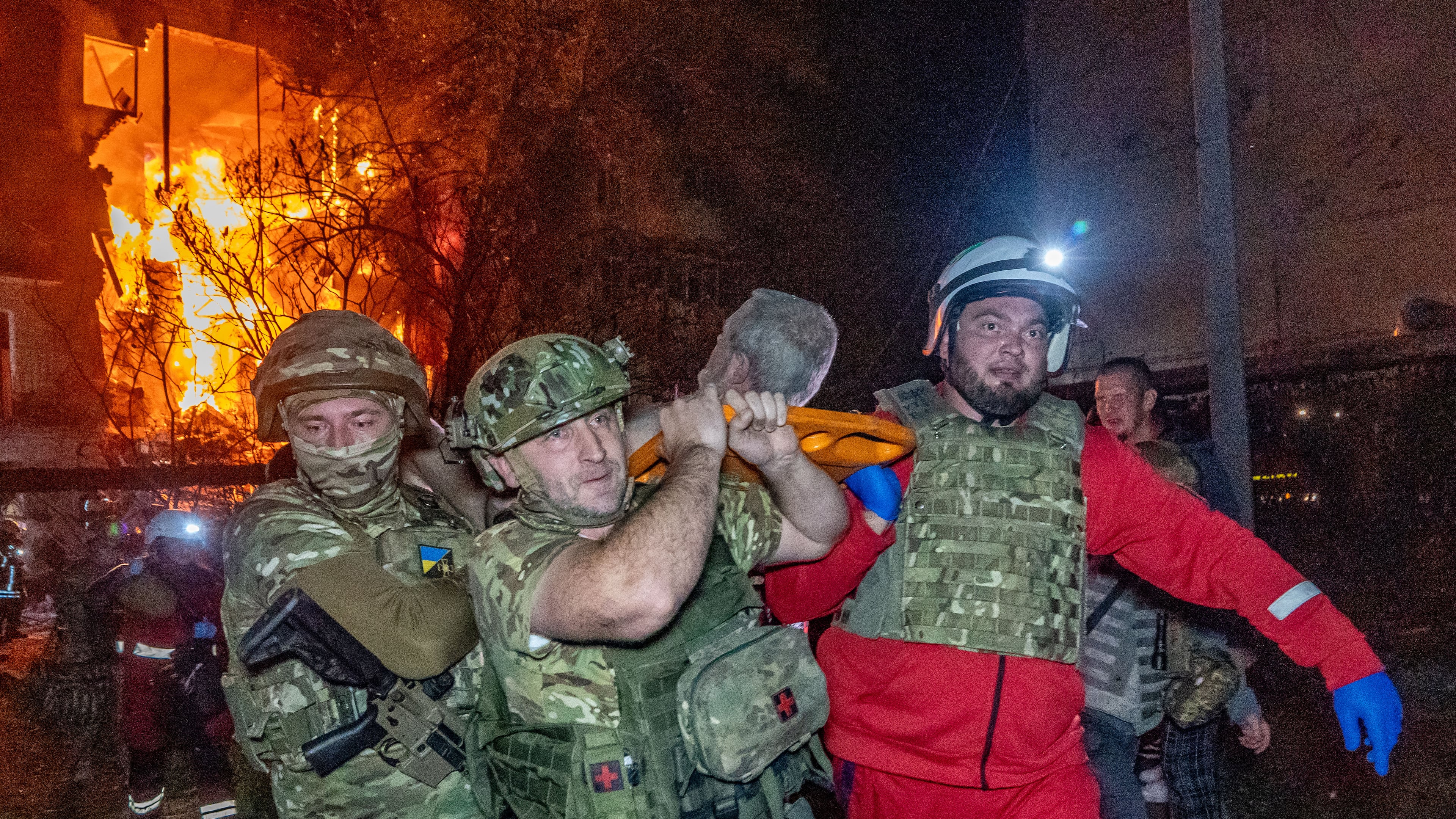 Rescuers evacuate an injured civilian after a residential building was hit following a Russian air attack in Kharkiv, Ukraine, Tuesday, Oct. 13, 2026. (AP Photo/Andrii Marienko)