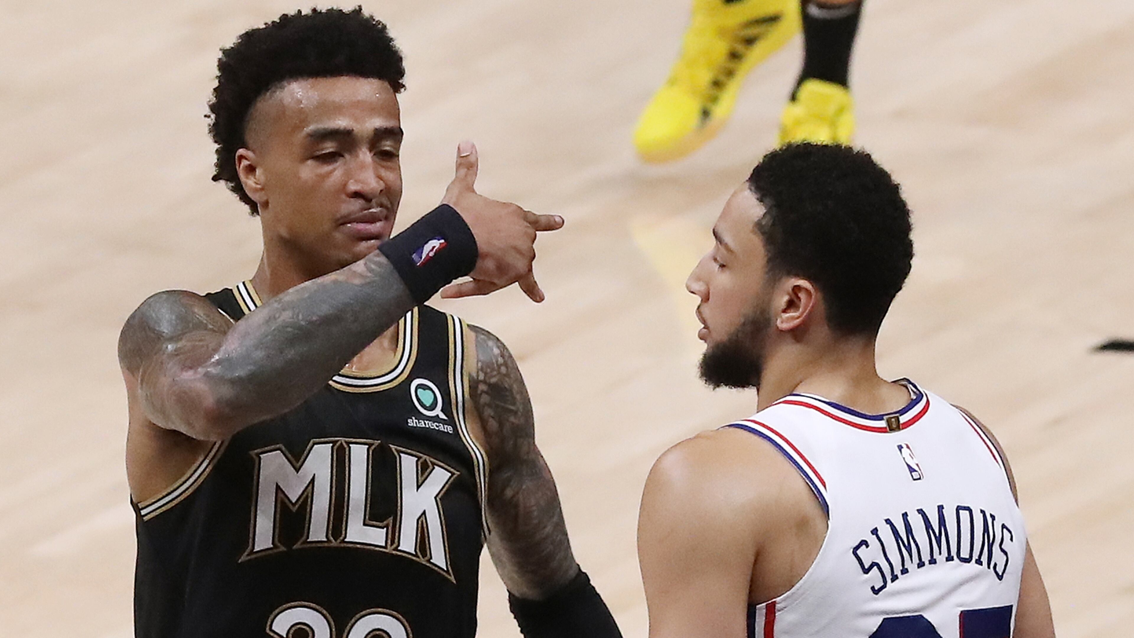 Hawks forward John Collins reacts to hitting a three pointer against Philadelphia 76ers guard Ben Simmons during the fourth quarter of a 103-100 victory over the 76ers in Game 4 of the Eastern Conference semifinals Monday, June 14, 2021, in Atlanta. (Curtis Compton / Curtis.Compton@ajc.com)