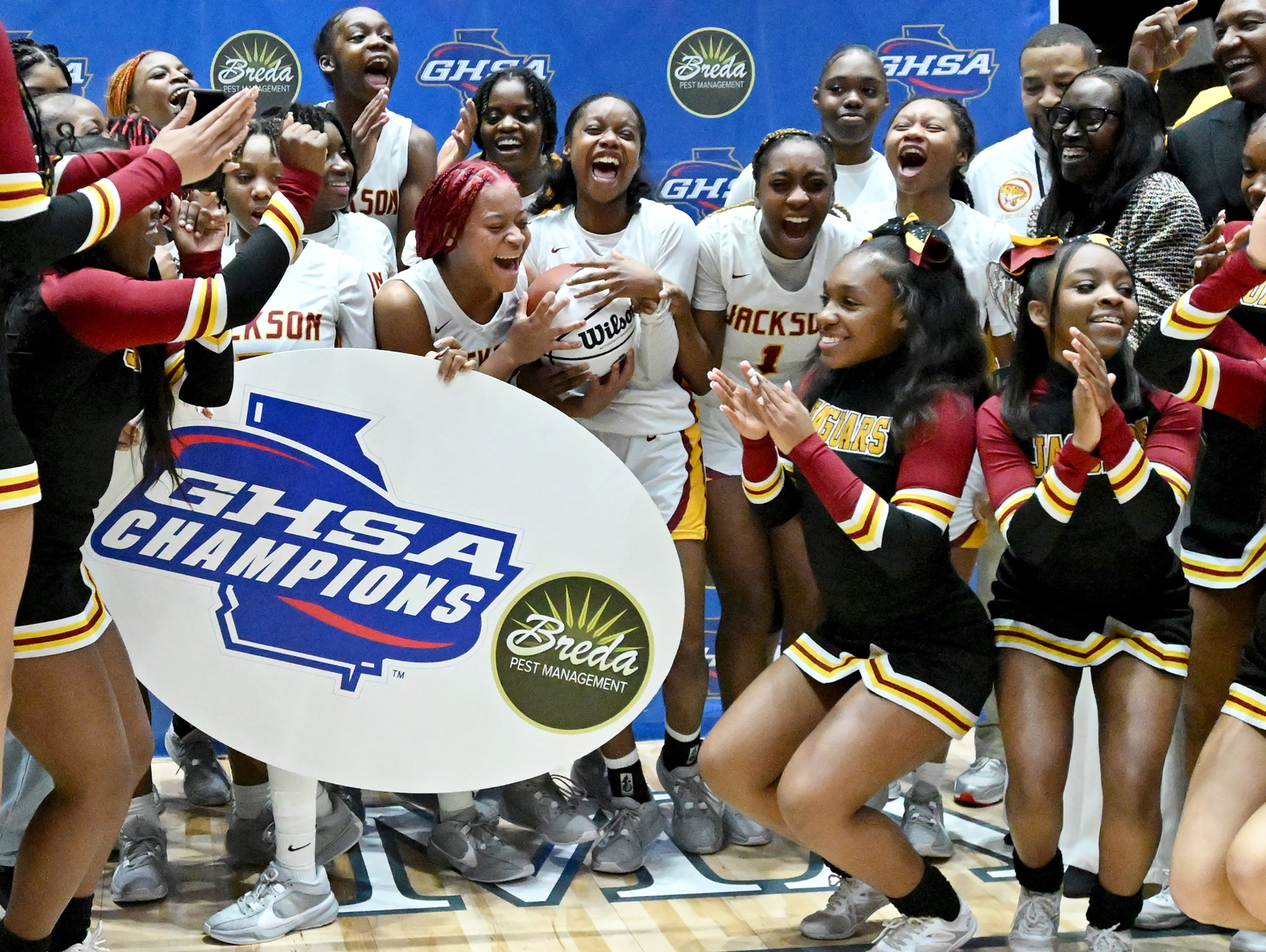 Jackson-Atlanta players celebrate their 58-44 victory over Midtown Thursday in the Class 5A girls championship game in Macon. (Hyosub Shin / Hyosub.Shin@ajc.com)