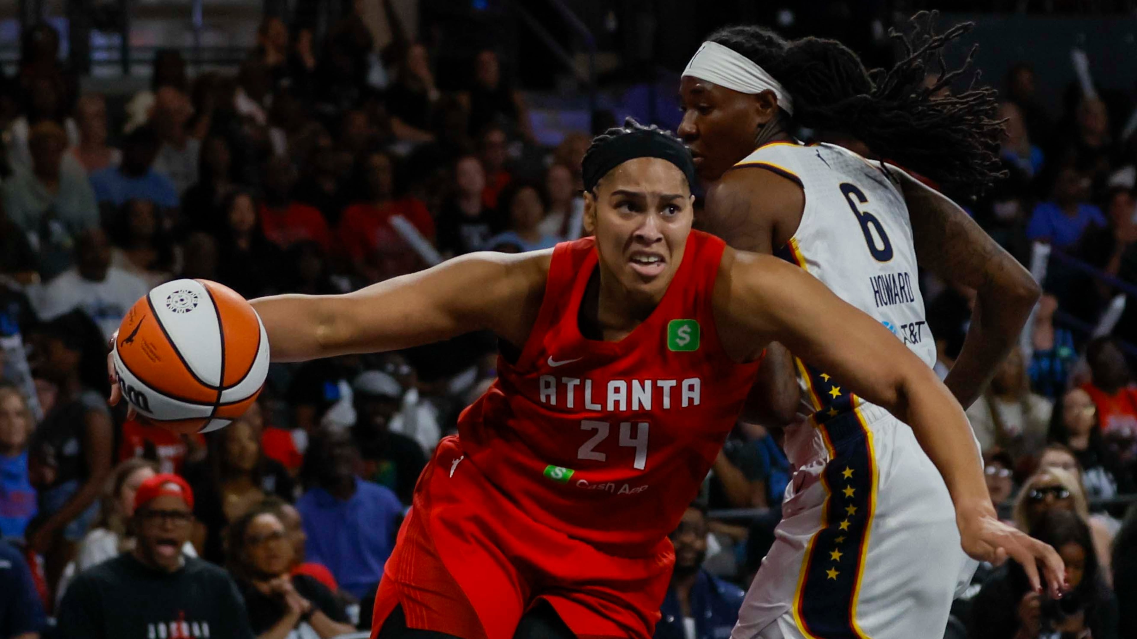 Atlanta Dream forward Brionna Jones (24) drbbles against Indiana Fever forward Natasha Howard (6) during the first half of a WNBA first-round playoff game at Gateway Center Arena on Thursday, Sept. 18, 2024, in Atlanta. (Miguel Martinez/ AJC)