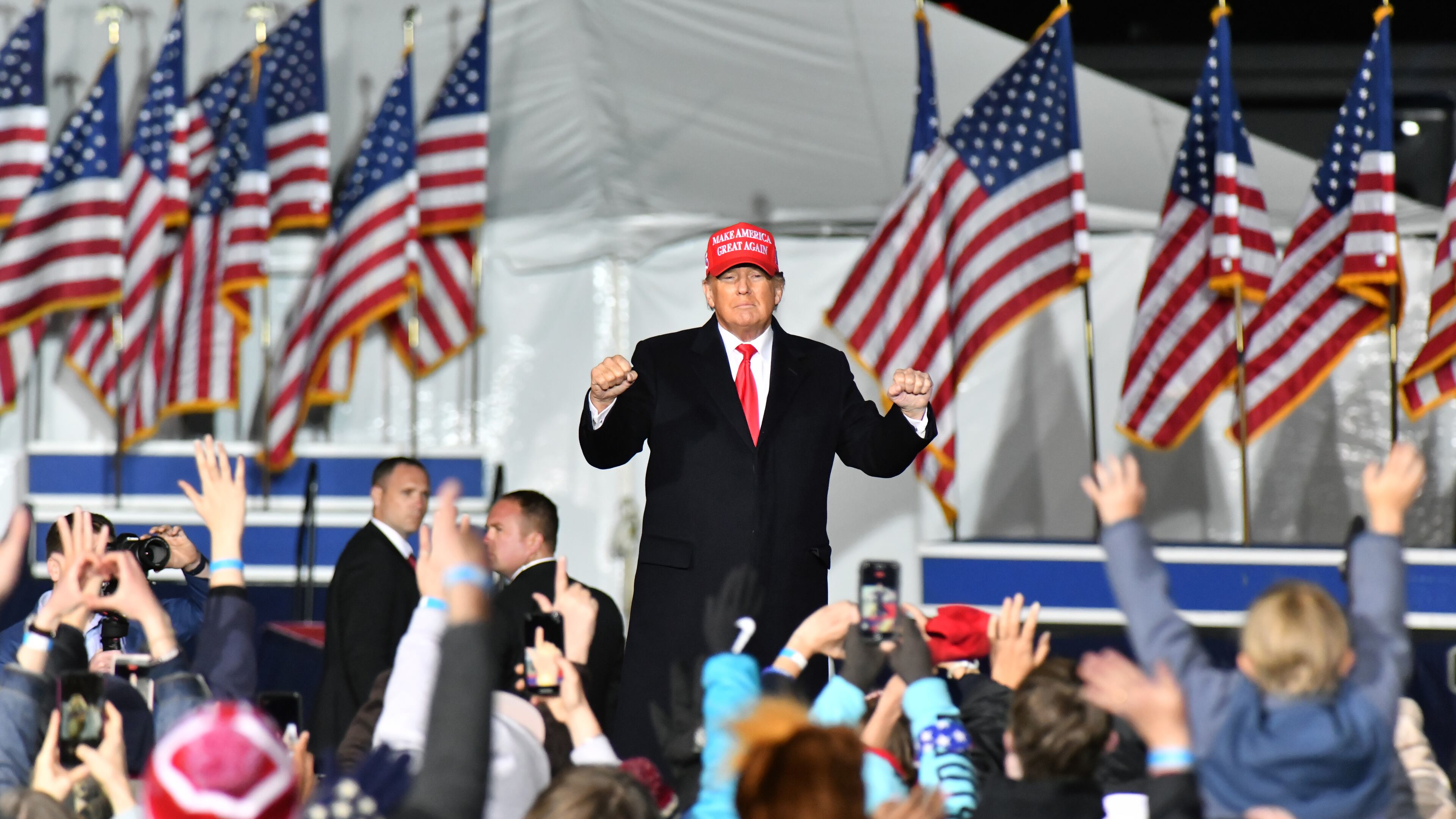 Former President Donald Trump dances as he leaves the stage during a rally for Georgia GOP candidates at Banks County Dragway in Commerce on Saturday, March 26, 2022. (Hyosub Shin / Hyosub.Shin@ajc.com)