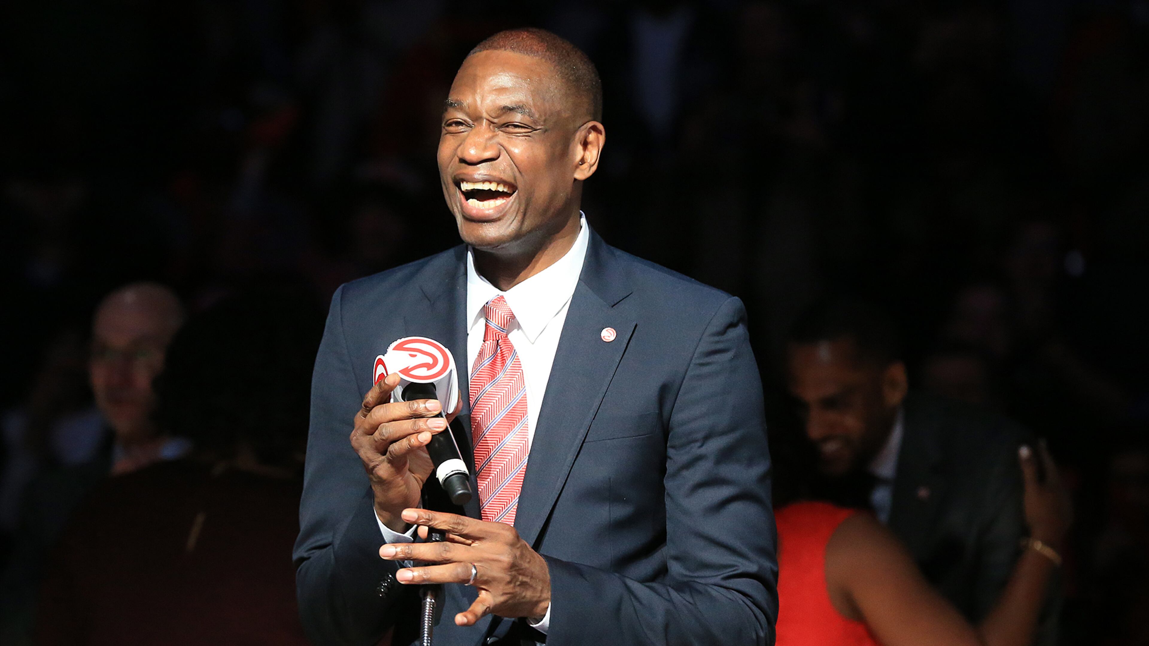 112415 ATLANTA: -- Hawks Legend Dikembe Mutombo is all smiles as he has his No. 55 jersey retired by the Hawks during half time in a basketball game against the Celtics on Tuesday, Nov. 24, 2015, in Atlanta. Curtis Compton / ccompton@ajc.com